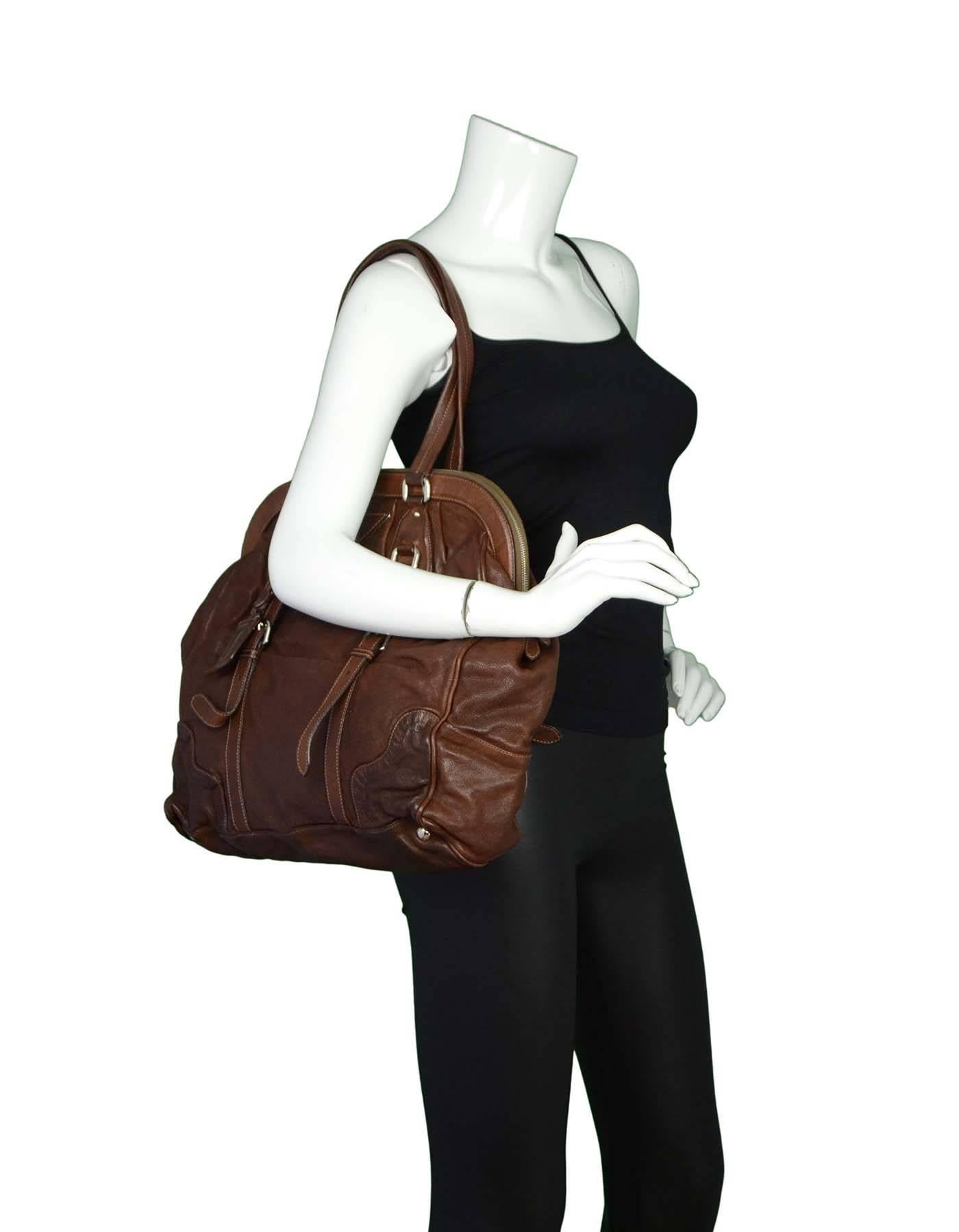 Prada Brown Leather XL Frame Shoulder Bag

Features Prada logo at front with buckle details at front and back

Made In: Italy
Color: Brown
Hardware: Silvertone
Materials: Leather
Lining: Brown leather
Closure/Opening: Zip top