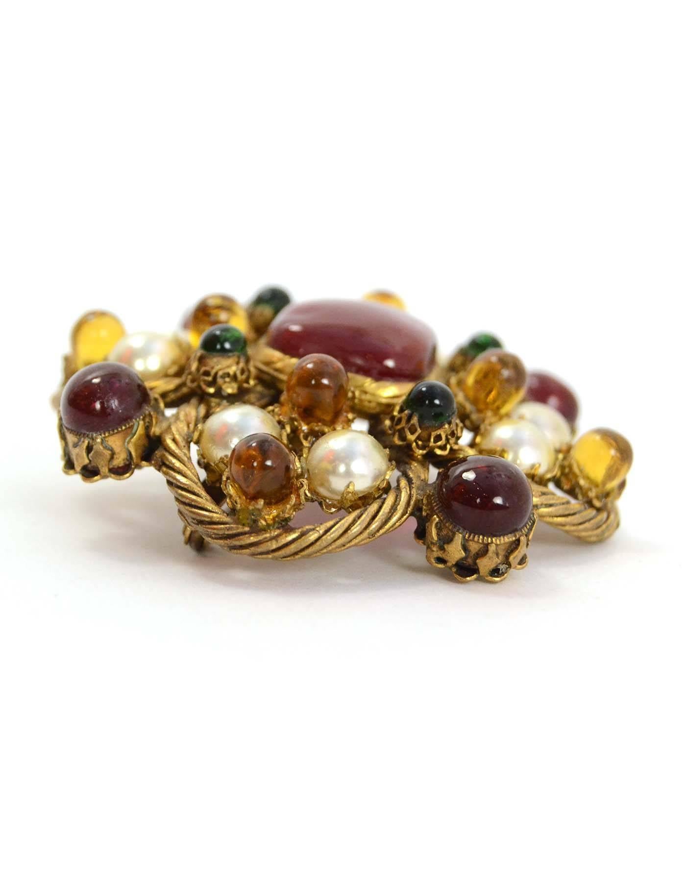 Chanel Vintage '93 Multi-Color Gripoix & Pearl Cluster Brooch
Features twisted goldtone metal detailing throughout
Made In: France
Year of Production: 1993
Color: Goldtone, red, amber, green, and ivory
Materials: Metal, gripoix, and faux