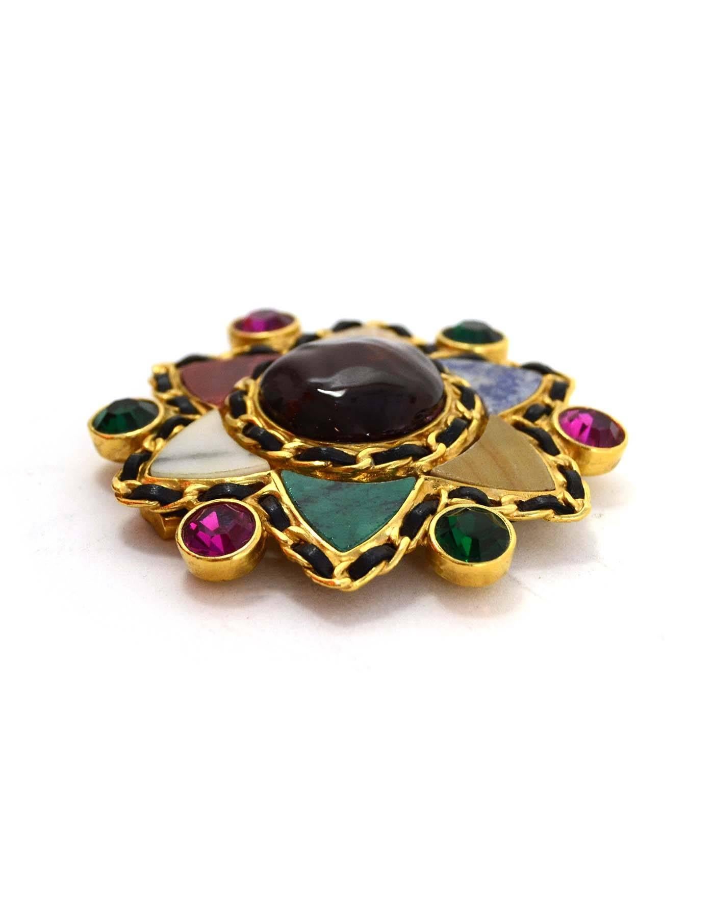 Chanel Multi-Color Gripoix & Crystal Star Brooch
Features leather woven chain details throughout and marble-like stone pieces as petals 

Made In: France
Year of Production: 1995
Color: Goldtone, red, blue, green, pink, black beige and