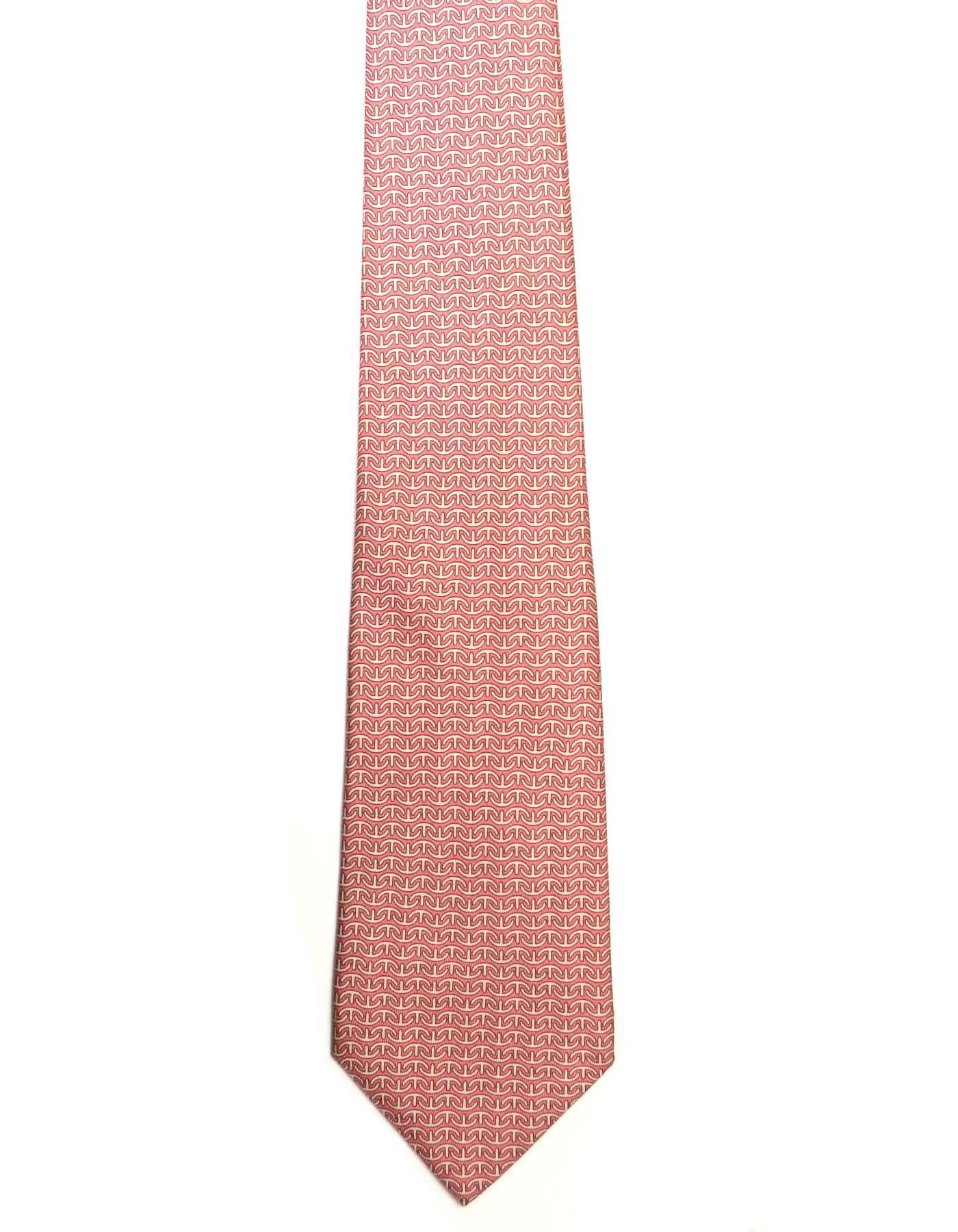 Hermes Pink Anchor Print Silk Tie
Made In: France
Color: Pink and beige
Composition: 100% silk
Overall Condition: Excellent pre-owned condition with the exception of a large, faint soiling spot towards bottom of tie (ref image)
Measurements: