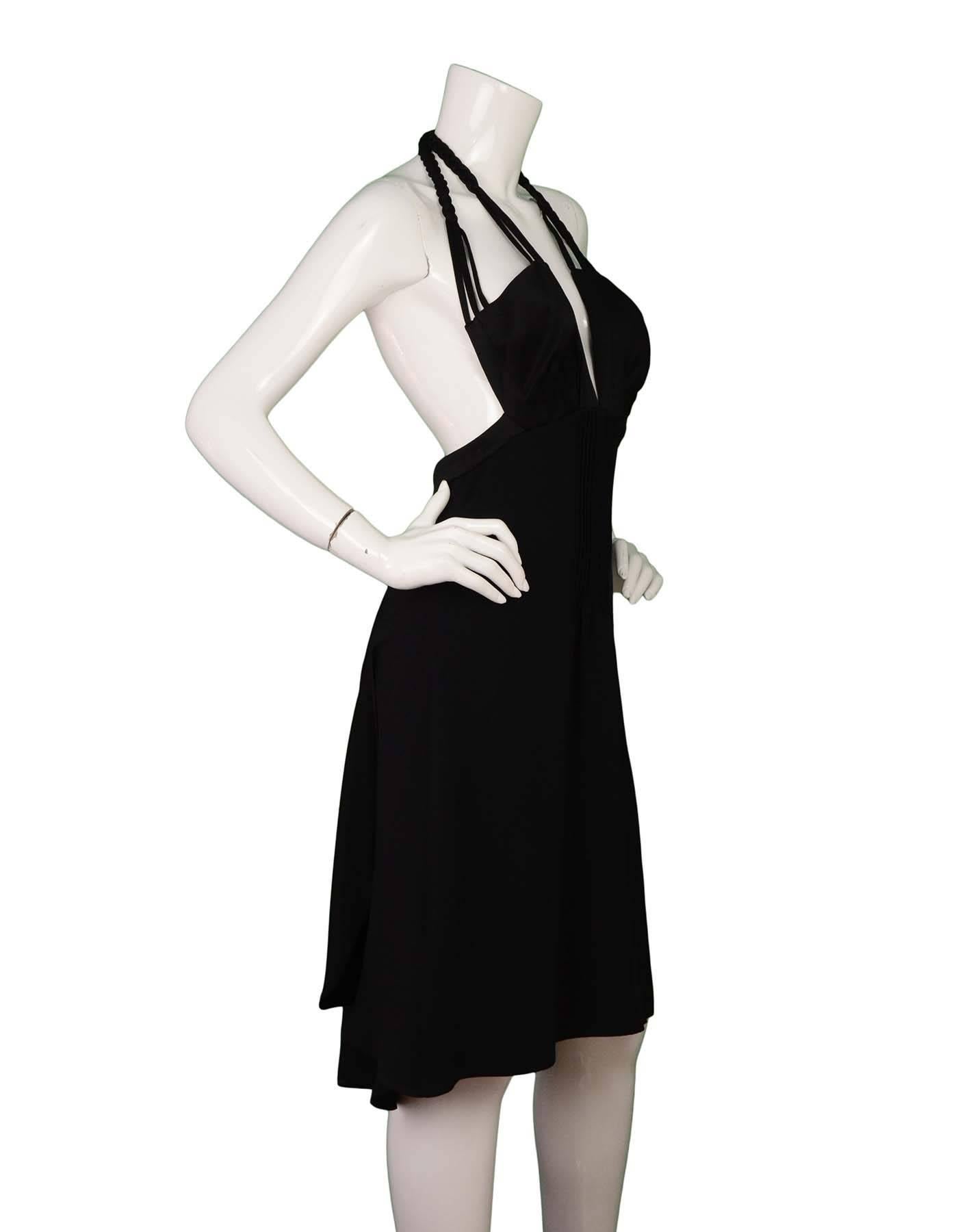 Miu Miu Black Silk Halter Neck Pleated Dress 
Features braided criss cross straps
Year of Production: 2011
Color: Black
Composition: Not given- believed to be a silk blend
Lining: Black, silk-blend
Closure/Opening: Back center zip up
Exterior