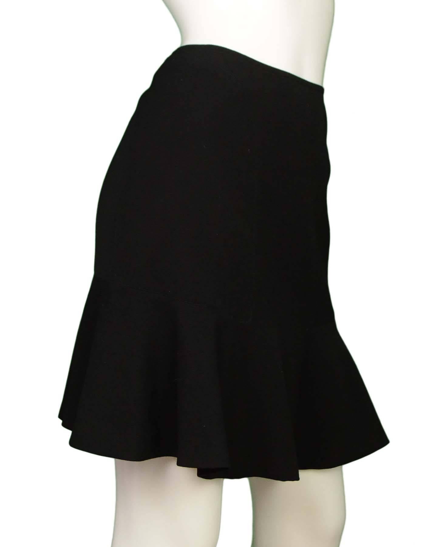 Alaia Black Wool Skirt Sz 44

Made In: France
Color: Black
Composition: 100% Wool
Lining: Black, 100% polyester
Closure/Opening: Hidden side zip closure
Exterior Pockets: None
Interior Pockets: None
Overall Condition: Excellent pre-owned