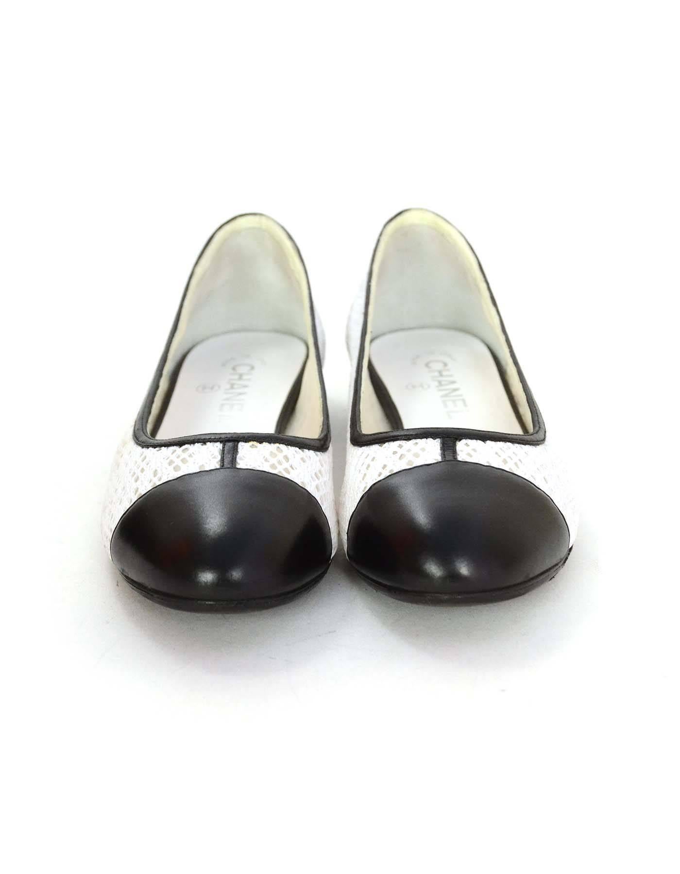 Chanel Black and White Eyelet Cap-Toe Flats Sz 37 In Excellent Condition In New York, NY