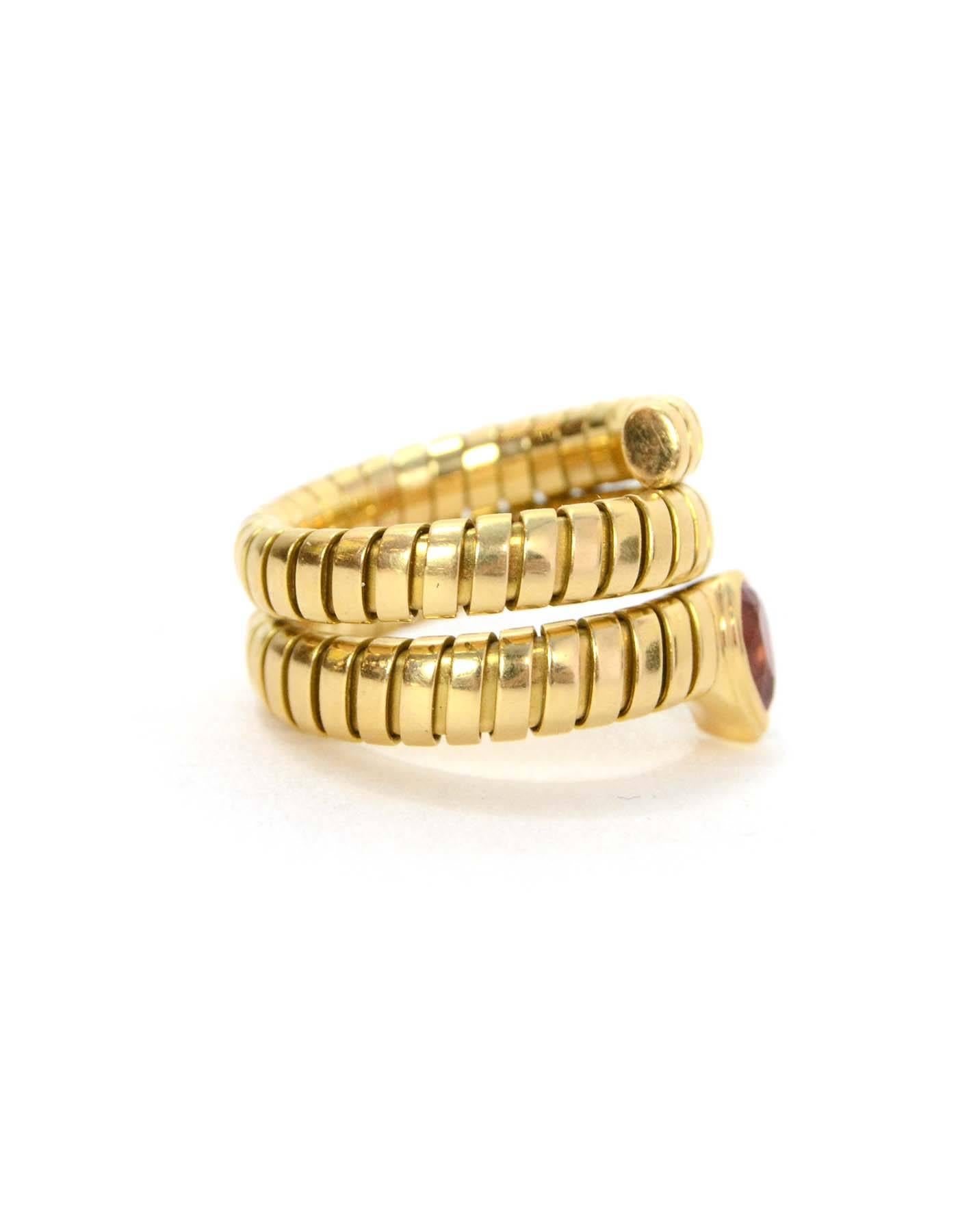 Bulgari 18k Gold Serpenti Tubogas Pink Tourmaline Ring 
Features flexibility for sizing

-Color: Gold and pink
-Materials: 18k gold and pink stone
-Closure: None
-Stamp: Bvlgari 10MI 750
-Retail Price: $6,750 + tax
-Overall Condition: