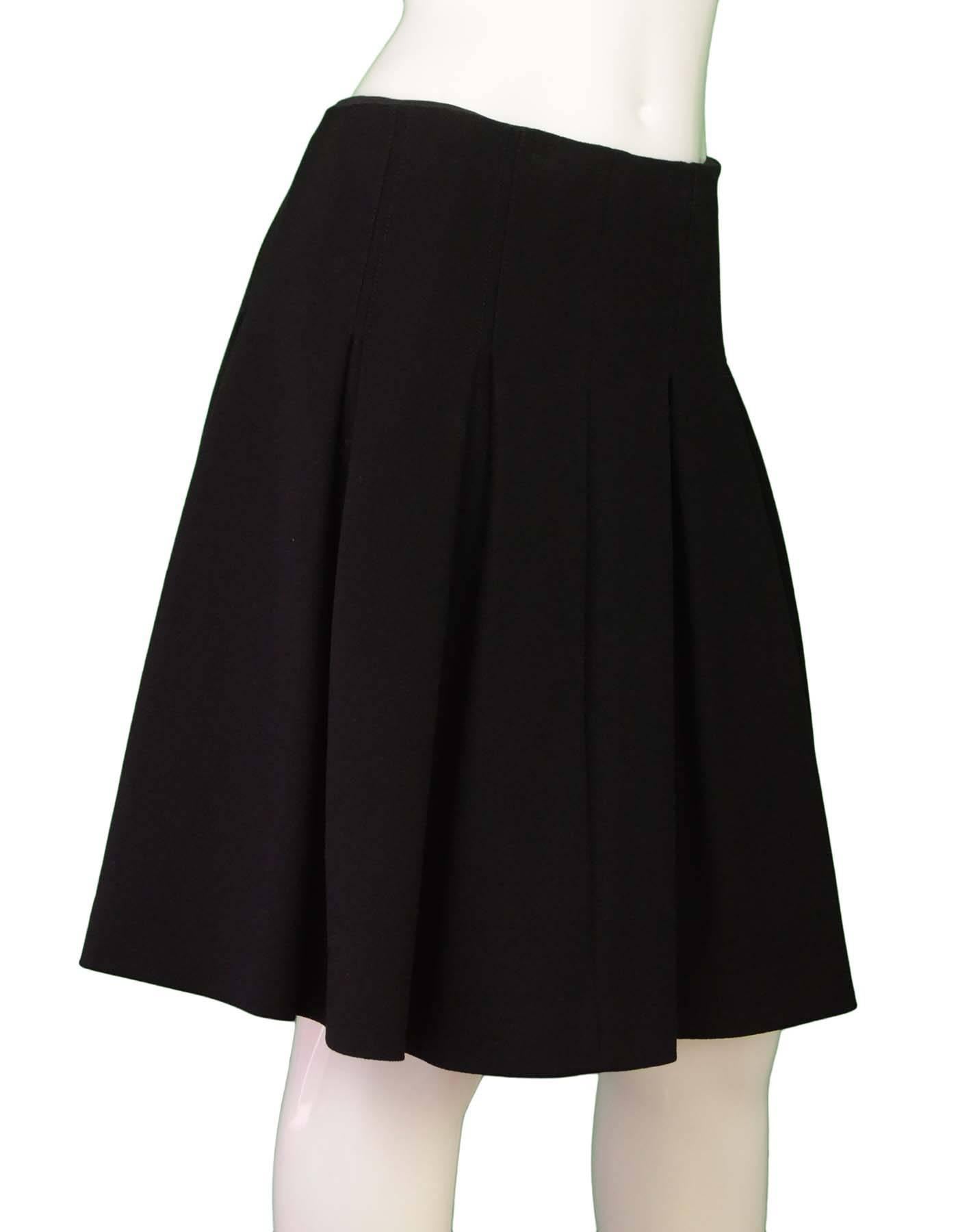 Proenza Schouler Black Inverted Pleated Skirt Sz 8

Made In: China
Color: Black
Composition: 51% Viscose, 34% Nylon, 15% Elastane
Lining: Black, 100% Silk
Closure/Opening: Hidden side zip closure
Exterior Pockets: None
Interior Pockets: