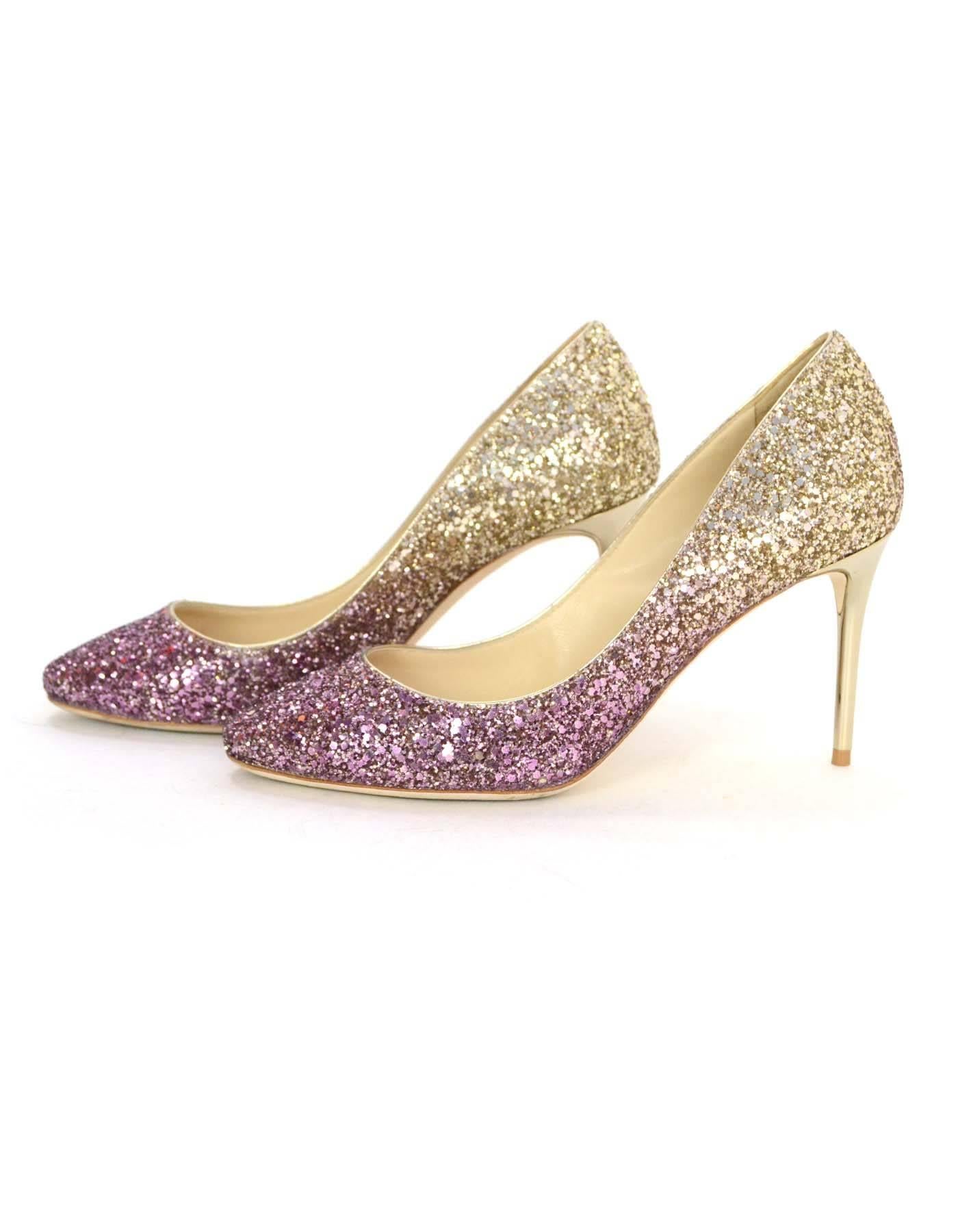 Jimmy Choo Esme Ombre Glitter Pumps Sz 36

Features almond toes and gold heels

Made In: Italy
Color: Pink and gold
Materials: Glitter
Closure/Opening: Slide on
Sole Stamp: Jimmy Choo London Made in Italy 36
Retail Price: $695 +