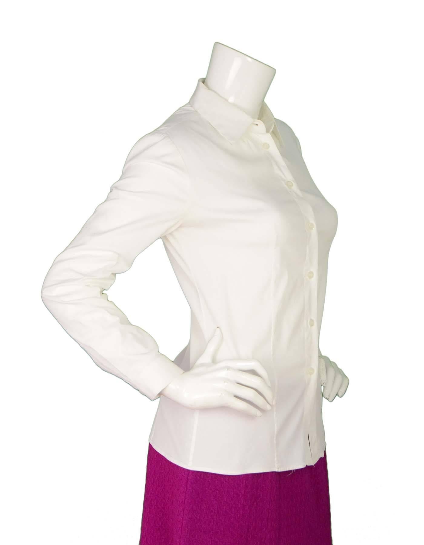 Prada White Button Up Top Sz 38

Color: White
Composition: Not listed, believed to be cotton blend
Lining: None
Closure/Opening: Button closure at front
Overall Condition: Very good pre-owned condition with faint marks at sleeves

Marked