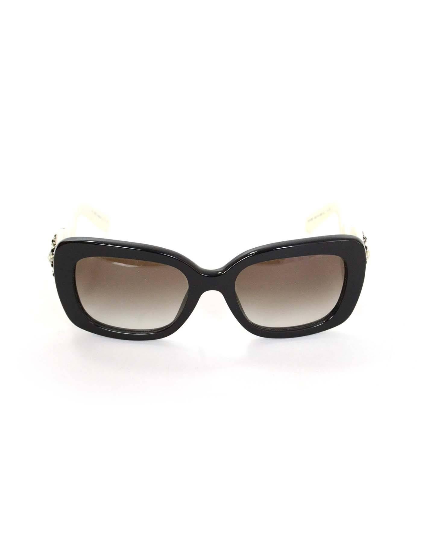 Prada Black and White Baroque Sunglasses with Crystals

Features black and white crystal accents at arms

Color: Black and white
Materials: Resin
Retail Value: $575 + tax
Overall Condition: Excellent pre-owned condition with the exception of