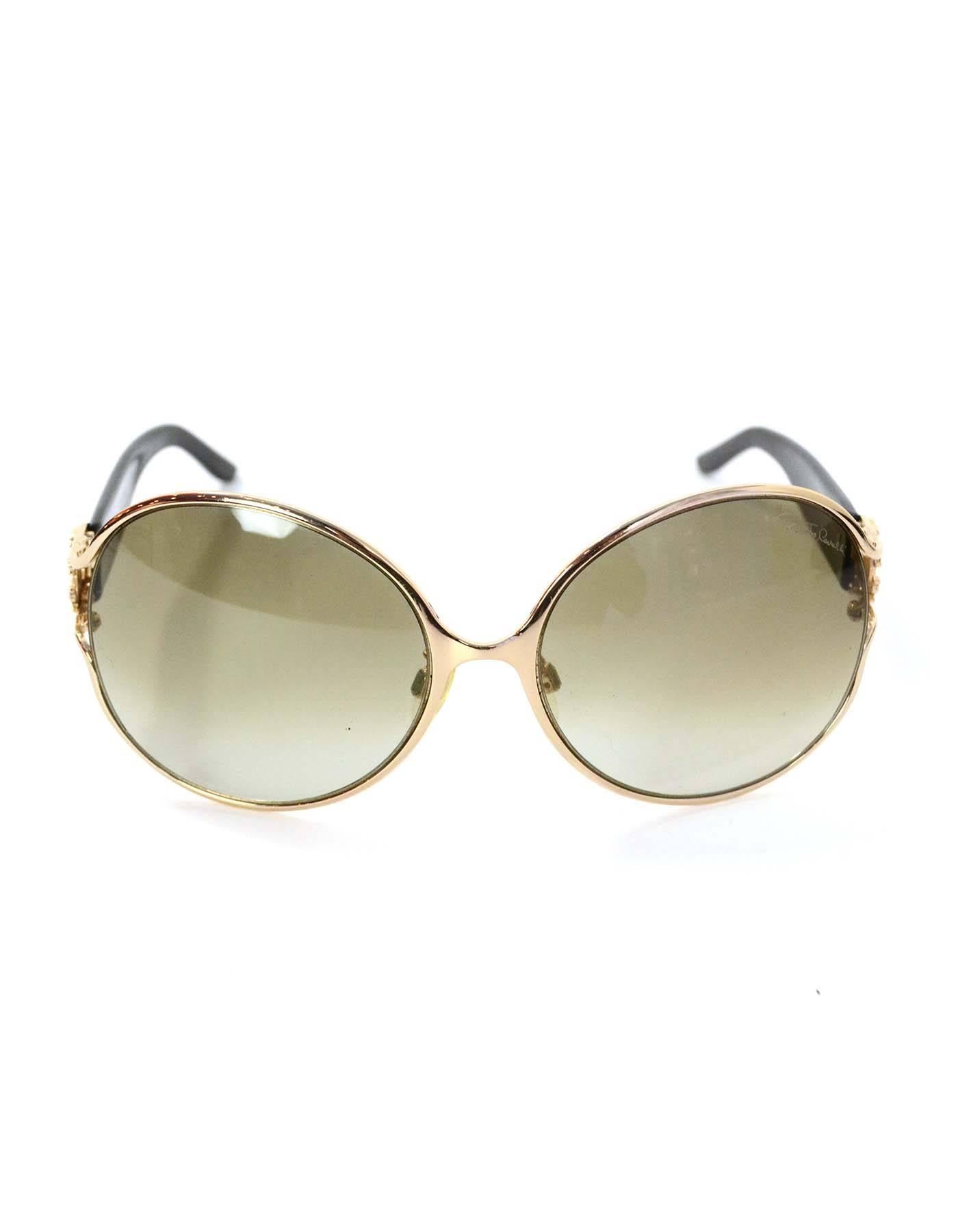Roberto Cavalli Round Frame Sunglasses with Crystals

Features crystal logo at arms

Made In: Italy
Color: Black and gold
Materials: Metal and resin
Overall Condition: Excellent pre-owned condition
Includes: Roberto Cavalli