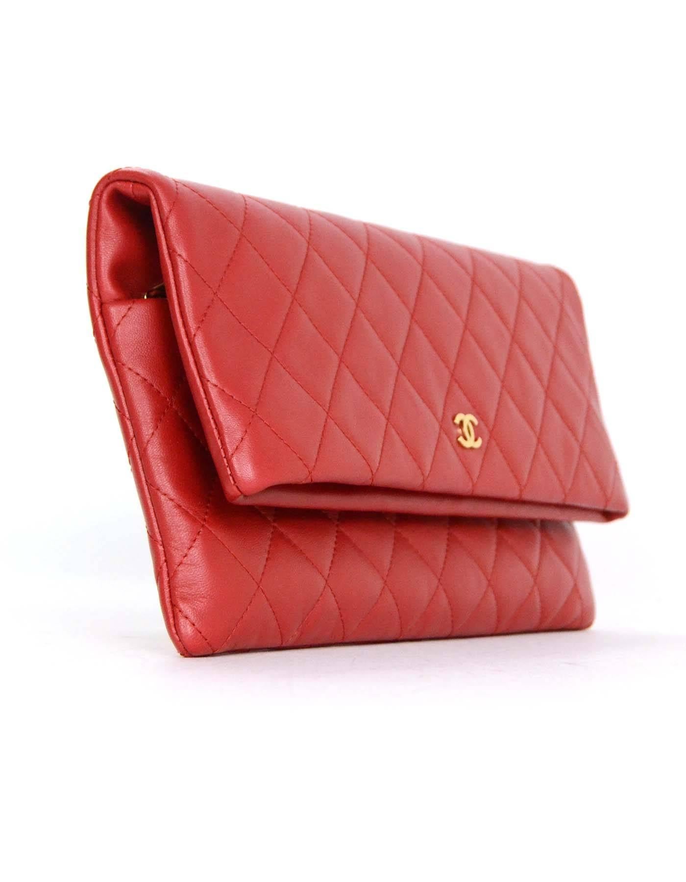 Featured light goltone CC at front of bag

    Made In: France
    Year of Production: 2015
    Color: Red
    Hardware: Light goldtone
    Materials: Red lambskin leather and metal
    Lining: Red quilted nylon
    Closure/Opening:Fold over