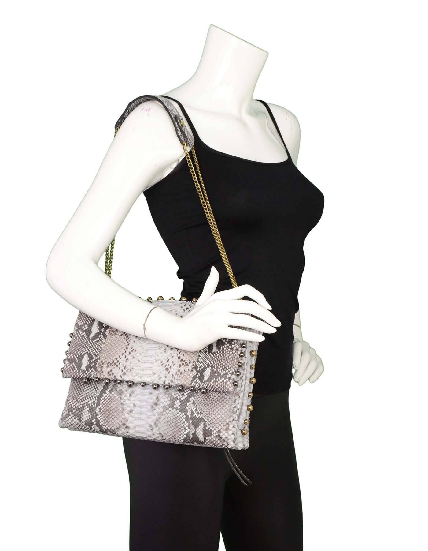 Lanvin Grey Python Studded Sugar Flap Bag

Features ruthenium and goldtone ball studs throughout

Made in: Italy
Color: Grey
Hardware: Ruthenium and goldtone
Materials: Python
Lining: Black textile
Closure/opening: Flap top closure with