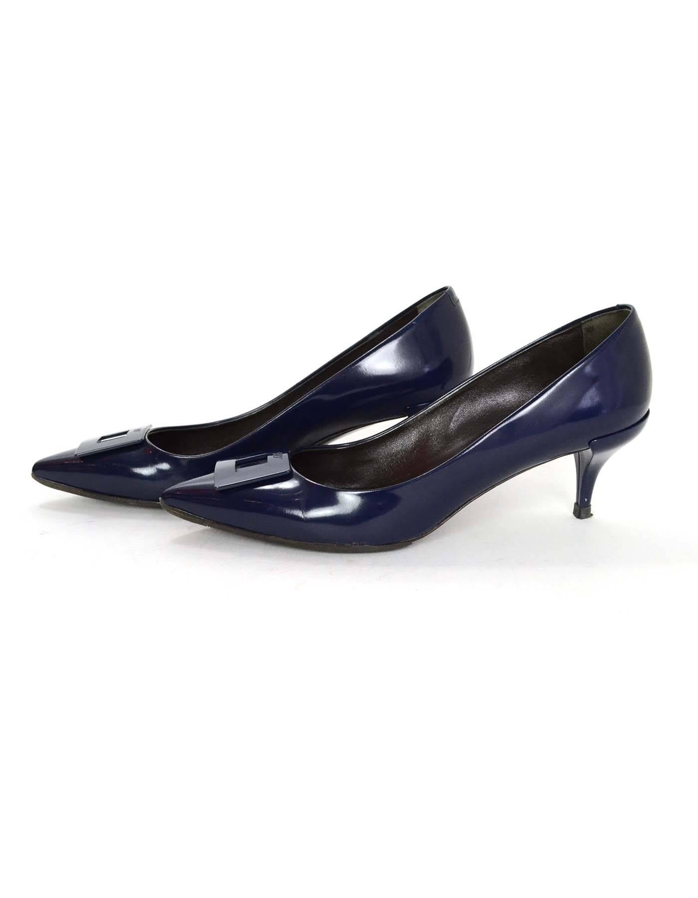 Roger Vivier Navy Glazed Leather Pumps Sz 36.5
Features pointed toes with signature buckle detail

Made In: Italy
Color: Navy
Materials: Glazed leather
Closure/Opening: Slide on
Sole Stamp: RV Made in Italy Women's size 36.5
Overall