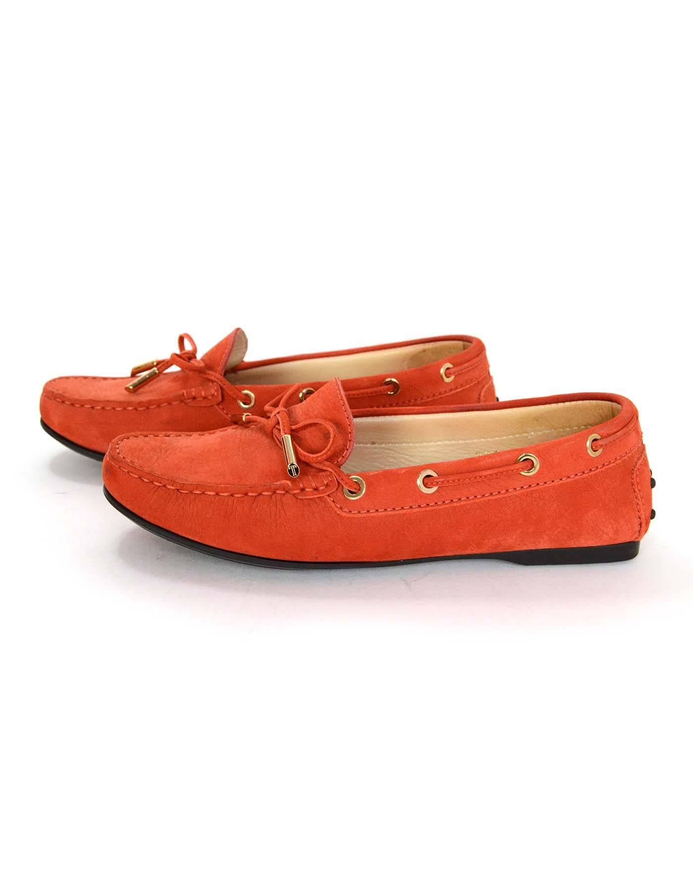 Tod's Orange Suede Riding Loafers Sz 36.5

Made in: Italy
Color: Orange
Materials: Leather and suede
Closure/opening: Slide on
Sole Stamp: Tod's
Overall Condition: Excellent pre-owned condition with the exception of light wear at soles and