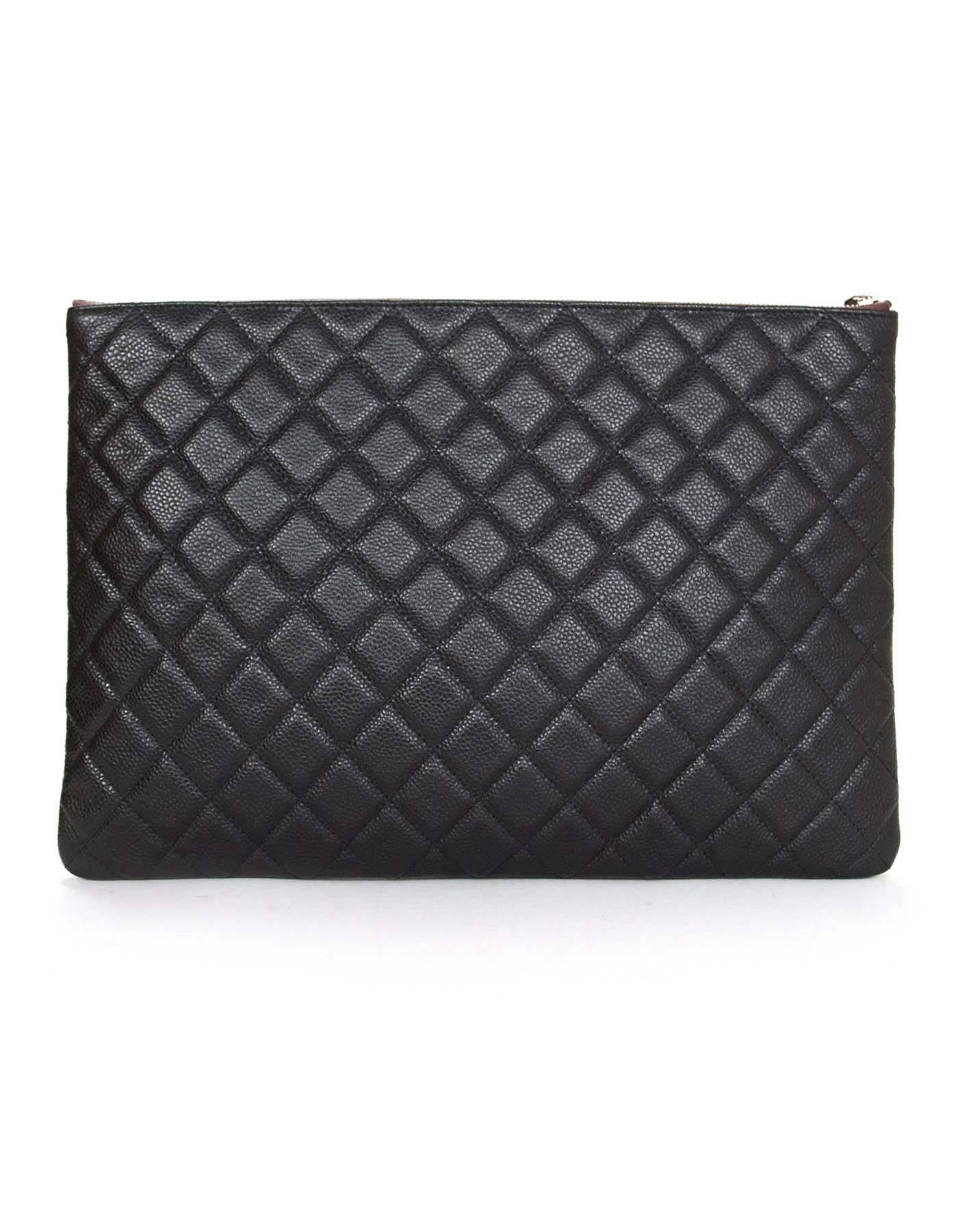 Features silvertone cc with zip top closure. Can be used as a clutch, pouch inside a larger bag or as a cosmetic bag

    Made in: Italy
    Year of Production: 2012
    Color: Black
    Hardware: Silvertone
    Materials: Caviar leather
   