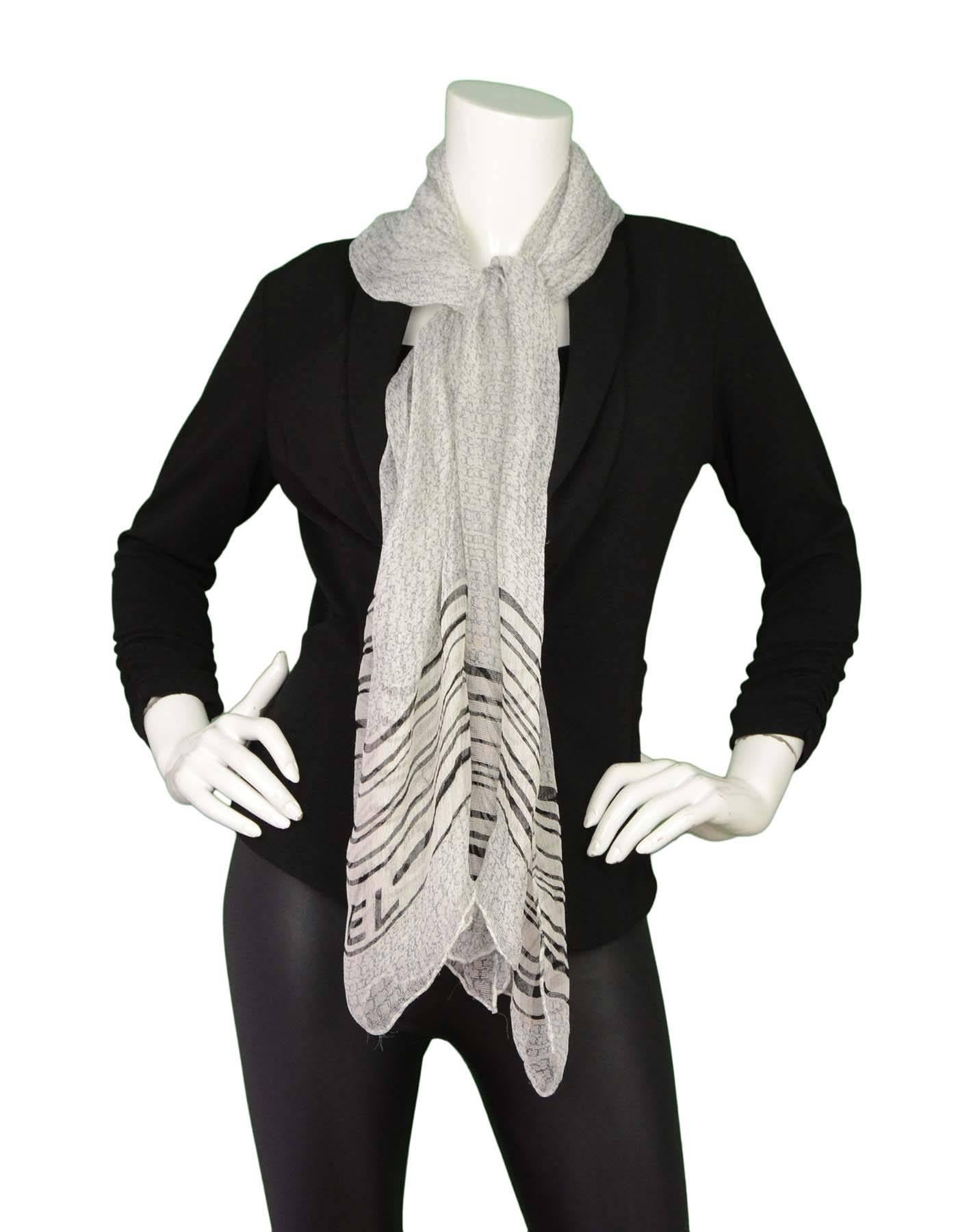Chanel Black and White Sheer Silk CC Scarf

Made in: Italy
Color: Black and white
Composition: 100% Silk
Overall Condition: Very good pre-owned condition with the exception of minor pulling

Length: 66