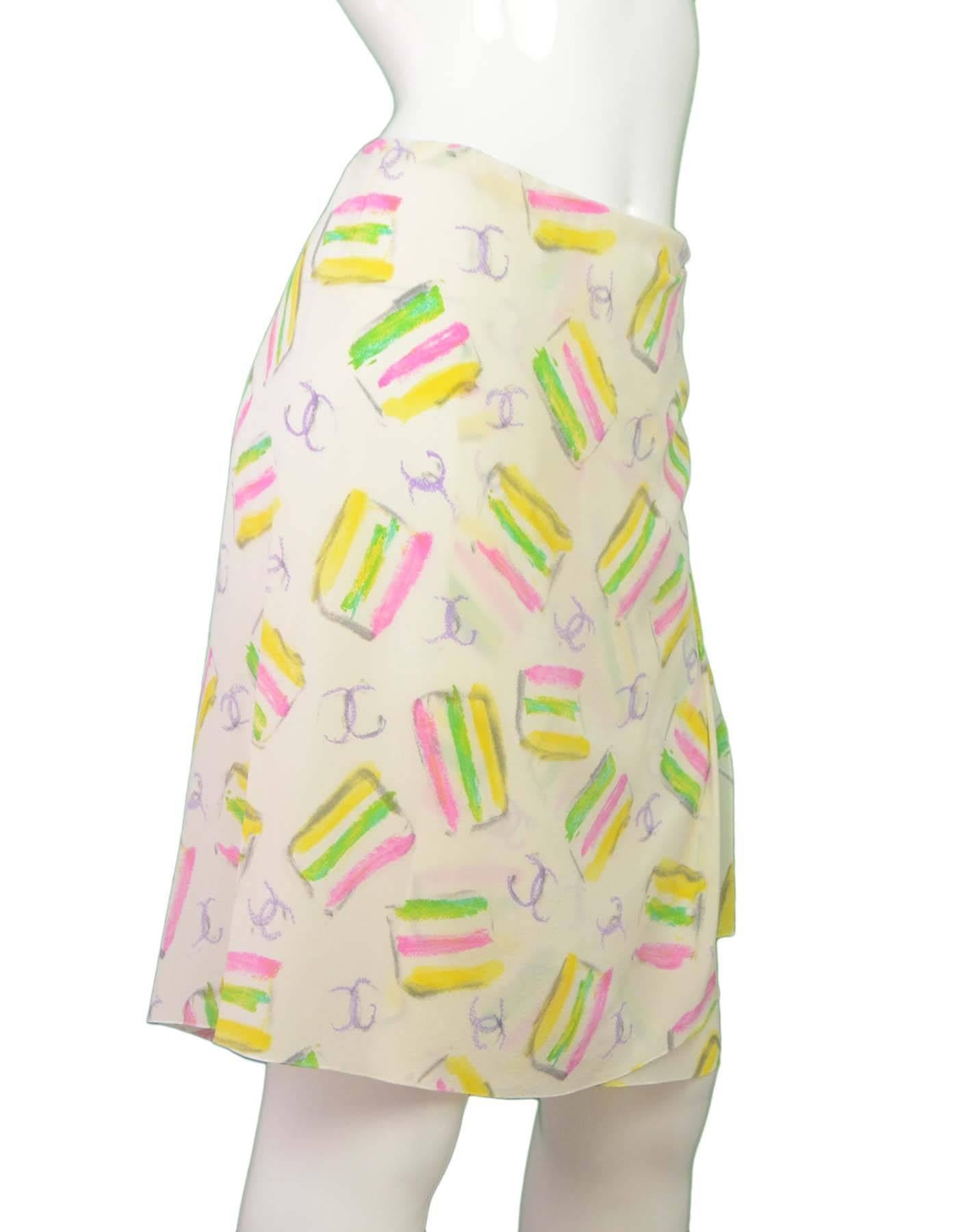 Chanel Ivory Silk Skirt with Pastel Stripes Sz 42
Features draped detail at side

Made In: France
Year Of Production: 2004 Cruise
Color: Ivory, pink, green, yellow
Composition: 100% Silk 
Lining: None
Closure/Opening: Button closure at