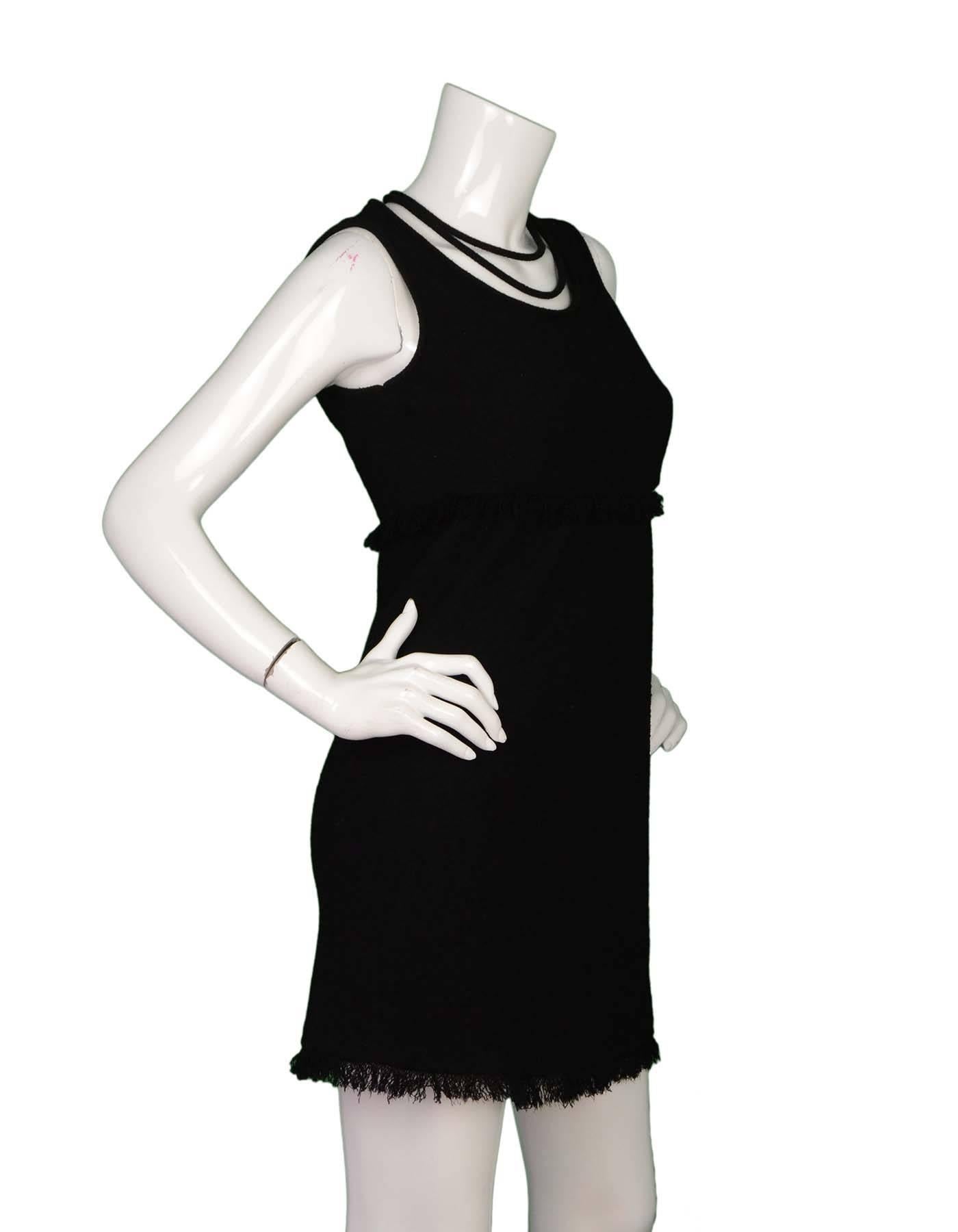 Chanel Black Wool Boucle Sleeveless Dress with Fringe  Sz 40
Features neckline detail and fringe trim

Made In: France
Year of Production: Recent collection
Color: Black
Composition: 85% Wool, 15% Nylon
Lining: Black silk