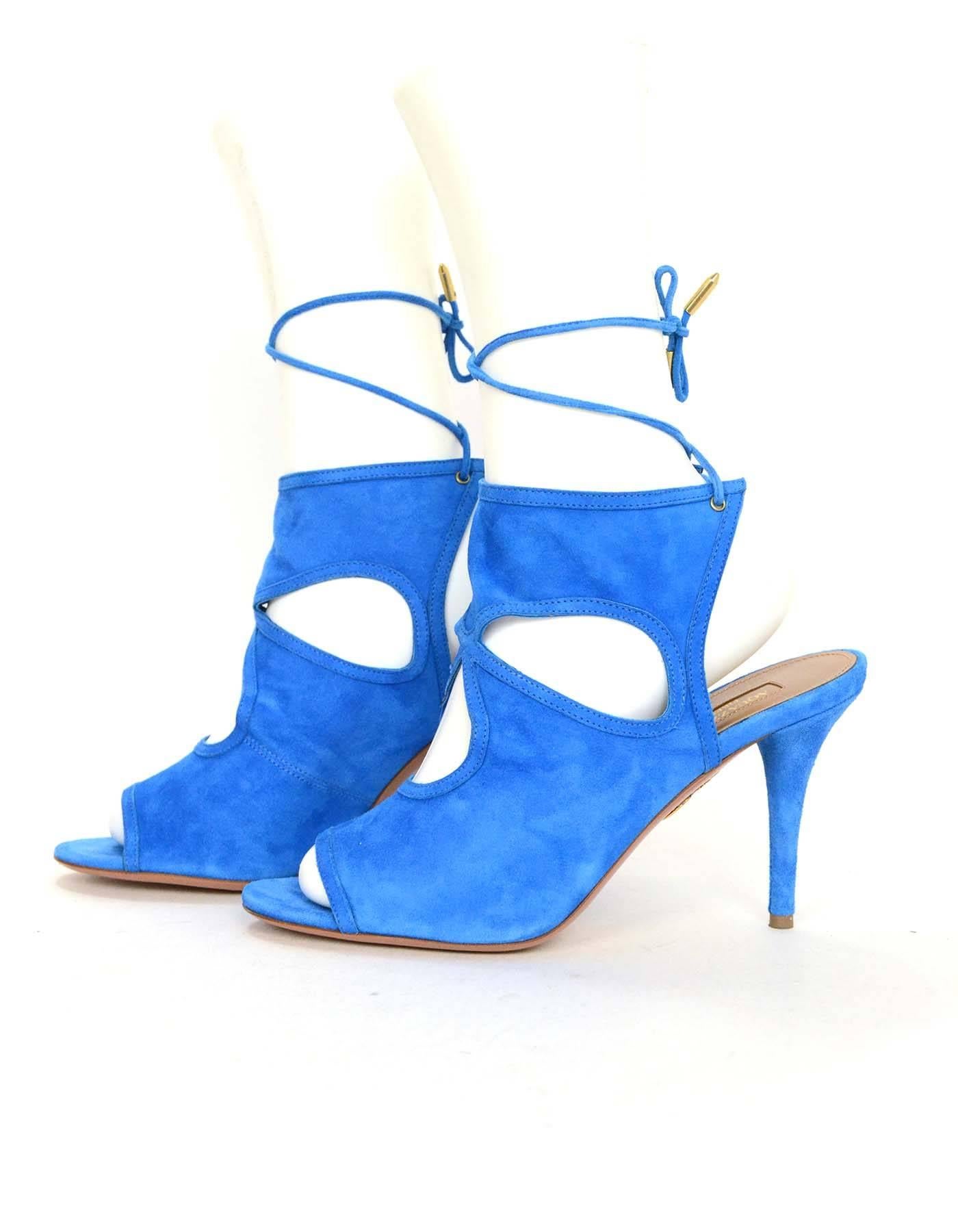 Aquazzura Blue Suede Cut-Out Booties 
Features tie back laces at ankle
Made In: Italy
Color: Blue
Materials: Suede
Closure/Opening: Back lace up tie
Sole Stamp: Aquazzura Firenze Vero Cuoio Made In Itay 38 1/2
Overall Condition: Excellent pre-owned