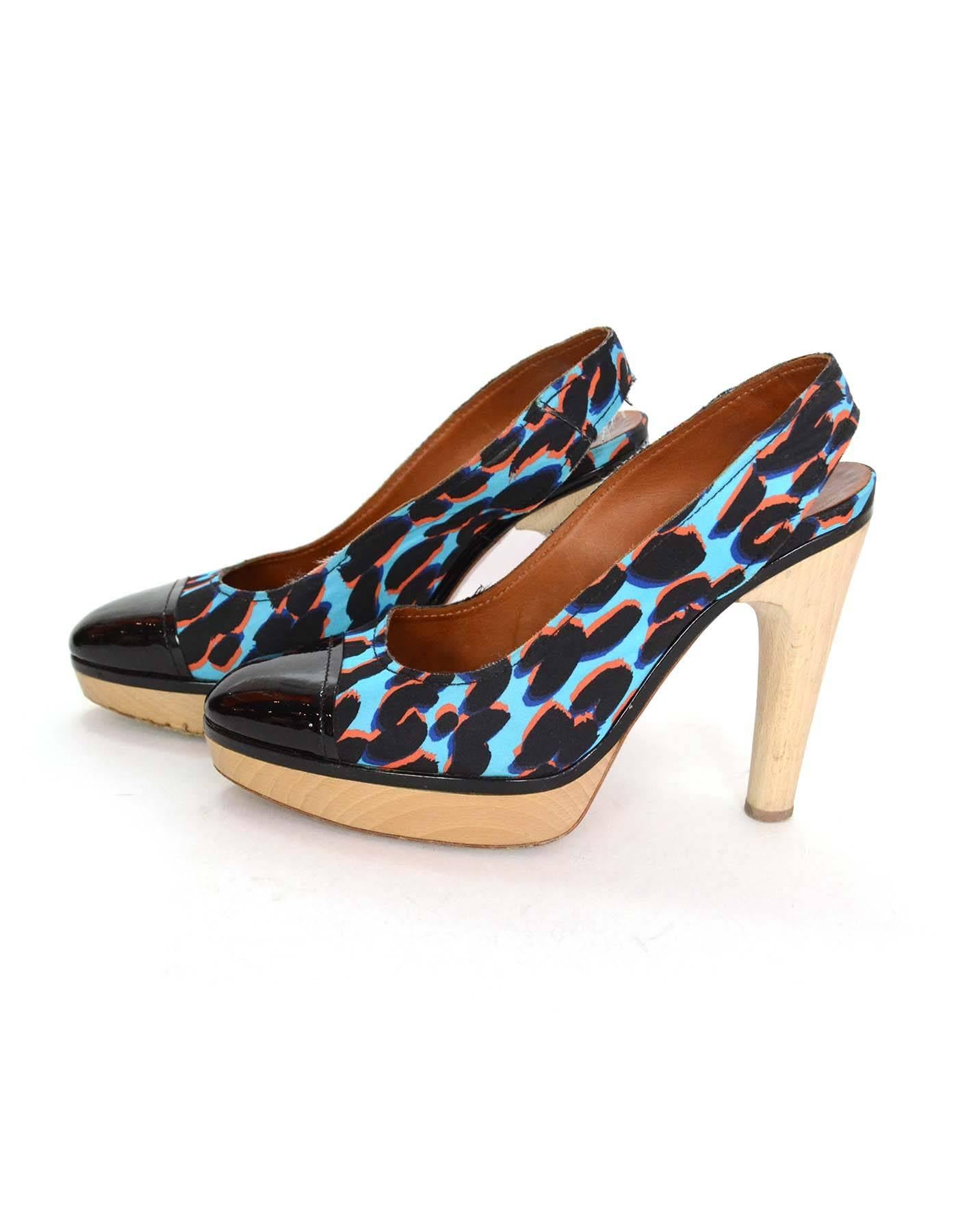 Lanvin Blue Leopard Print Slingback Clog Pumps
Features black patent leather toe cap and piping

Made In: Italy
Color: Black, blue, and tan
Materials: Silk blend, patent leather and wood
Closure/Opening: Sling back
Sole Stamp: Lanvin Made in