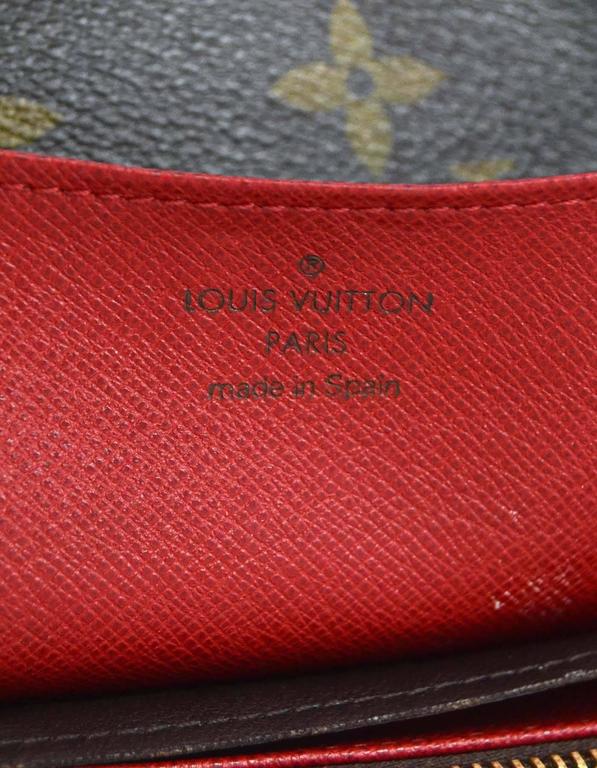 Louis Vuitton Brown Monogram Coated Canvas Emilie Wallet w/ Red Lining at  1stDibs