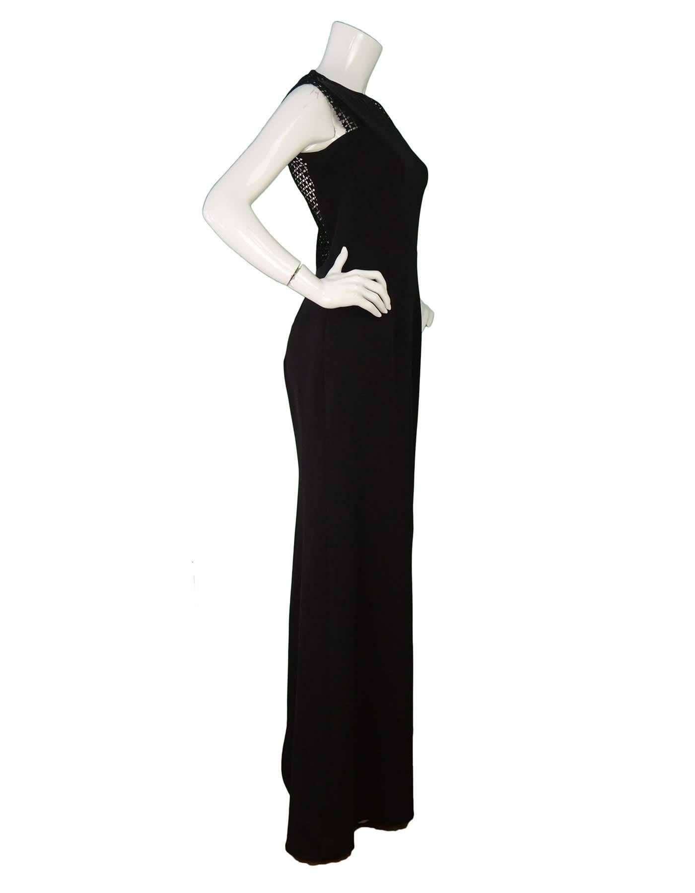 Dress No241 Black Gown Sz 8
Features windowpane lace detail and exposed back zip closure

Made In: England
Color: Black
Composition: 50% Silk, 50% Wool
Lining: None
Closure/Opening: Full exposed back zip closure
Overall Condition: Excellent