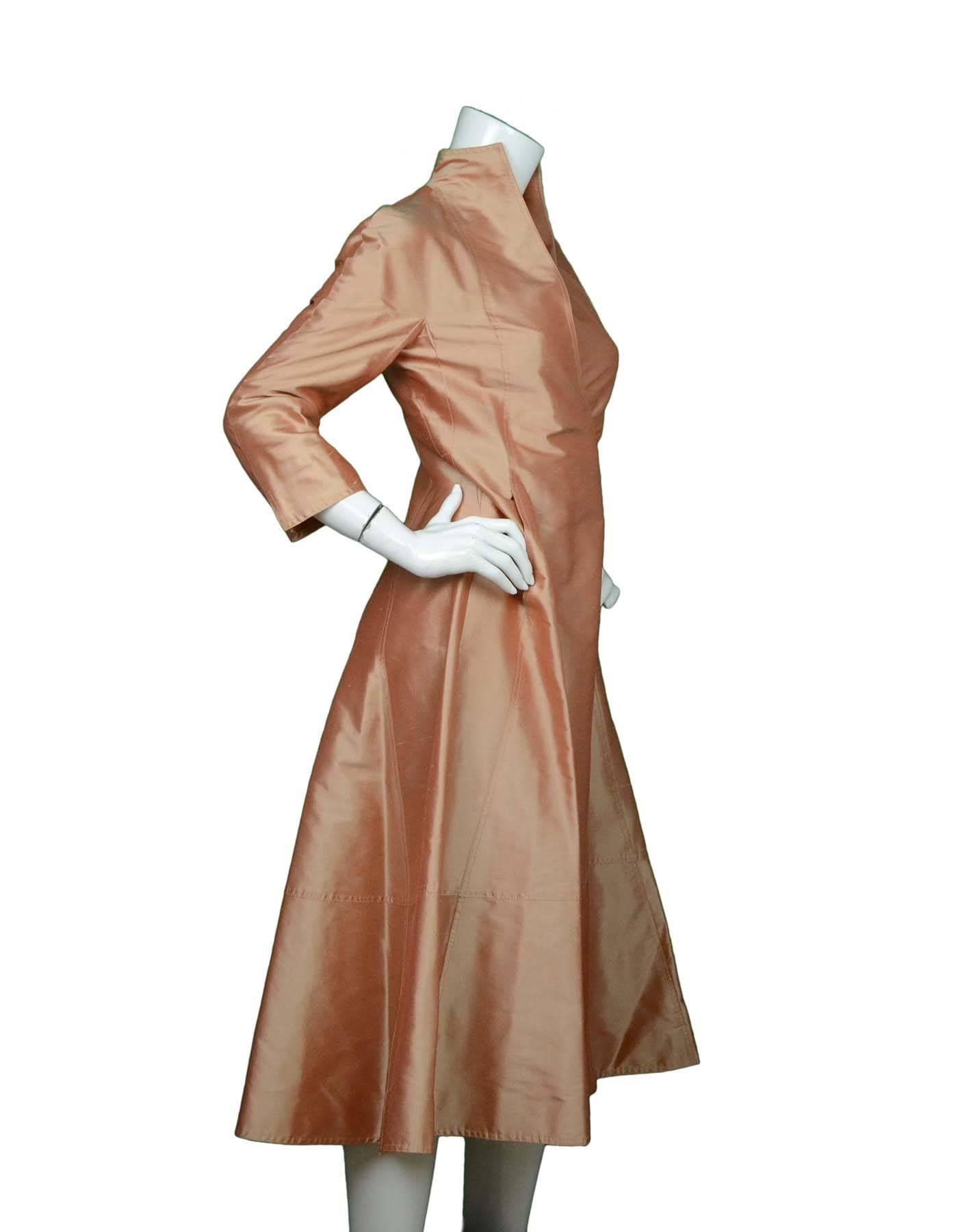 Chado Ralph Rucci Peach Silk Wrap Dress Sz 4

Features sash

Made In: USA
Color: Peach
Composition: 100% Silk
Lining: None
Exterior Pockets: Two hidden slit pockets at hips
Closure/Opening: Hidden hook and eye closure at front
Overall