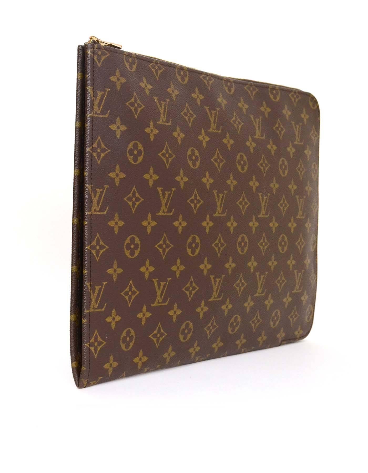 Louis Vuitton Monogram Portfolio Clutch

Made In: France
Year of Production: 1990
Color: Brown
Hardware: Goldtone
Materials: Coated canvas
Lining: Coated canvas
Closure/Opening: Zip across closure
Exterior Pockets: None
Interior Pockets:
