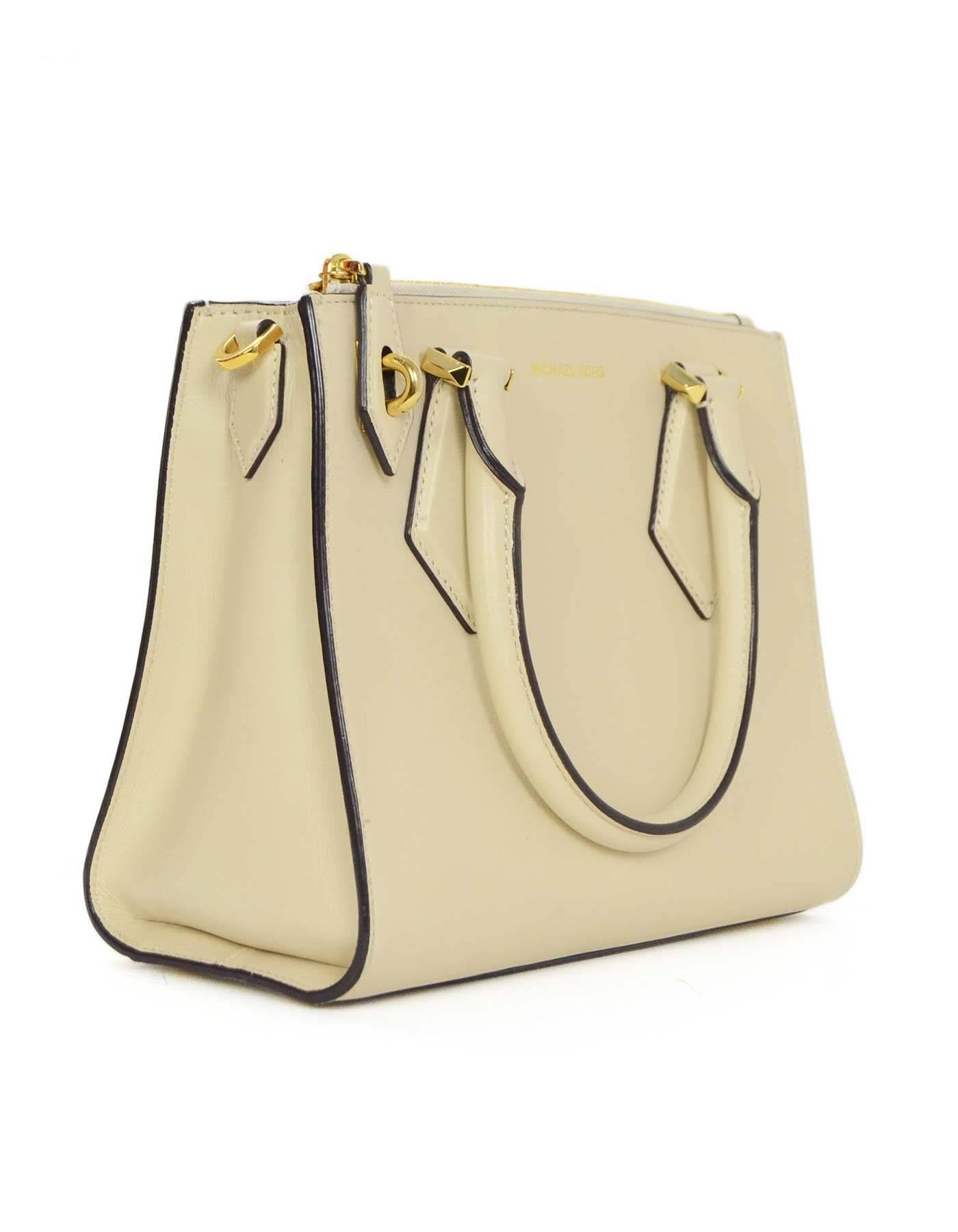 Michael Kors Vanilla Small Casey Satchel 
Features detachable crossbody strap
Made In: China
Color: Vanilla (cream)
Hardware: Goldtone
Materials: Leather
Lining: Gold satin
Closure/Opening: Open top
Exterior Pockets: One zipper pocket at front panel