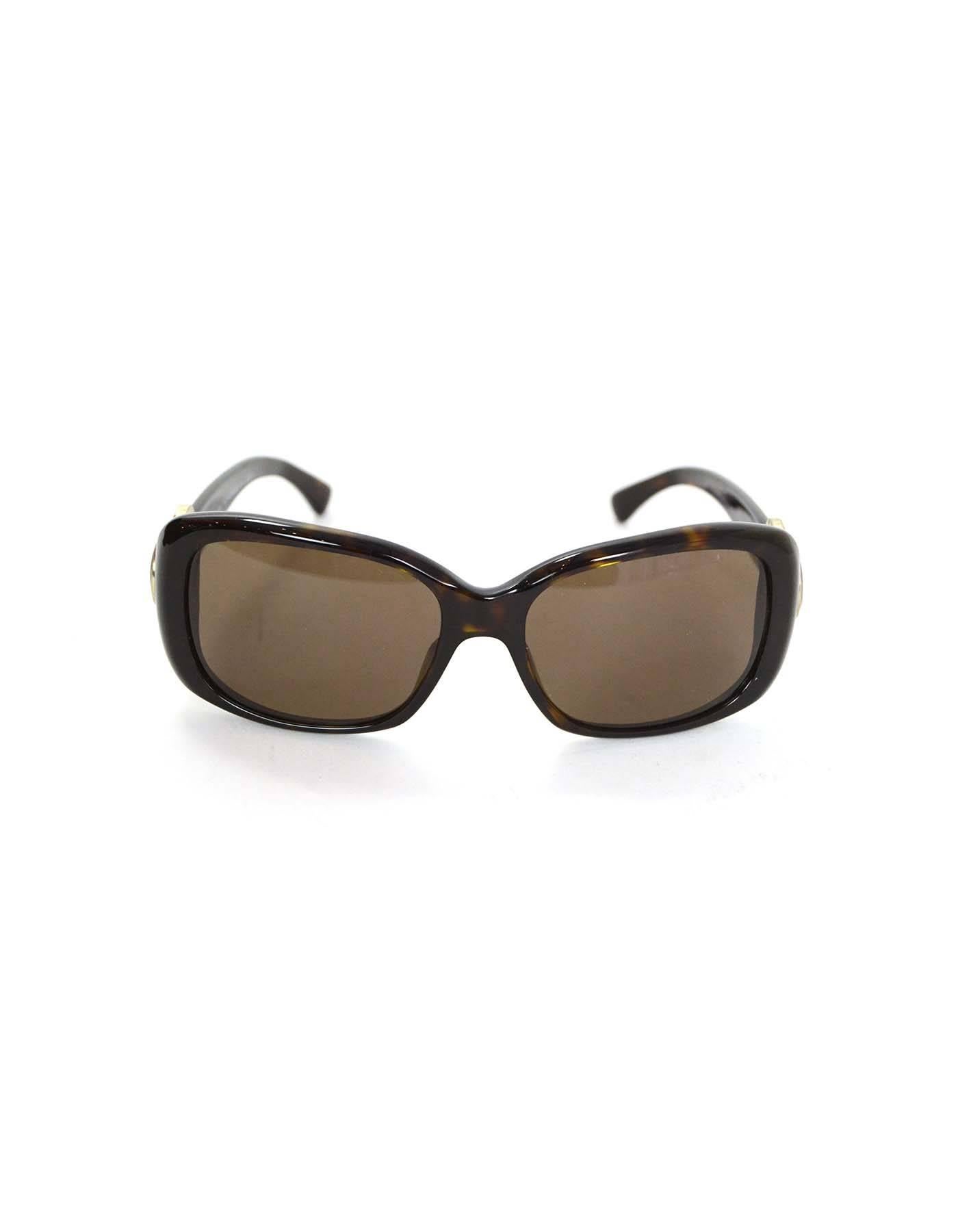 Chanel Tortoise Bouton Sunglasses with Enamel Circles

Features CC logo at sides

Made In: Italy
Color: Brown and lavender
Materials: Resin and enamel
Retail Price: $350 + tax
Overall Condition: Excellent pre-owned condition with the