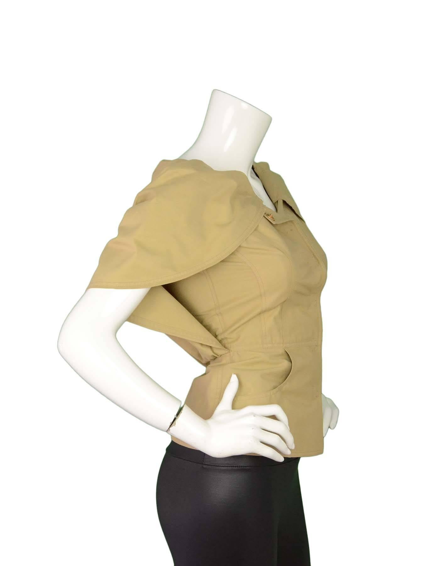 Fendi Beige Cape Jacket Sz 38 NWT

Made In: Italy
Color: Beige
Composition: 63% Cotton, 37% Nylon
Lining: None
Closure/Opening: Snap button closure at front
Exterior Pockets: Two side pockets
Interior Pockets: None
Retail Price: $1,990 +
