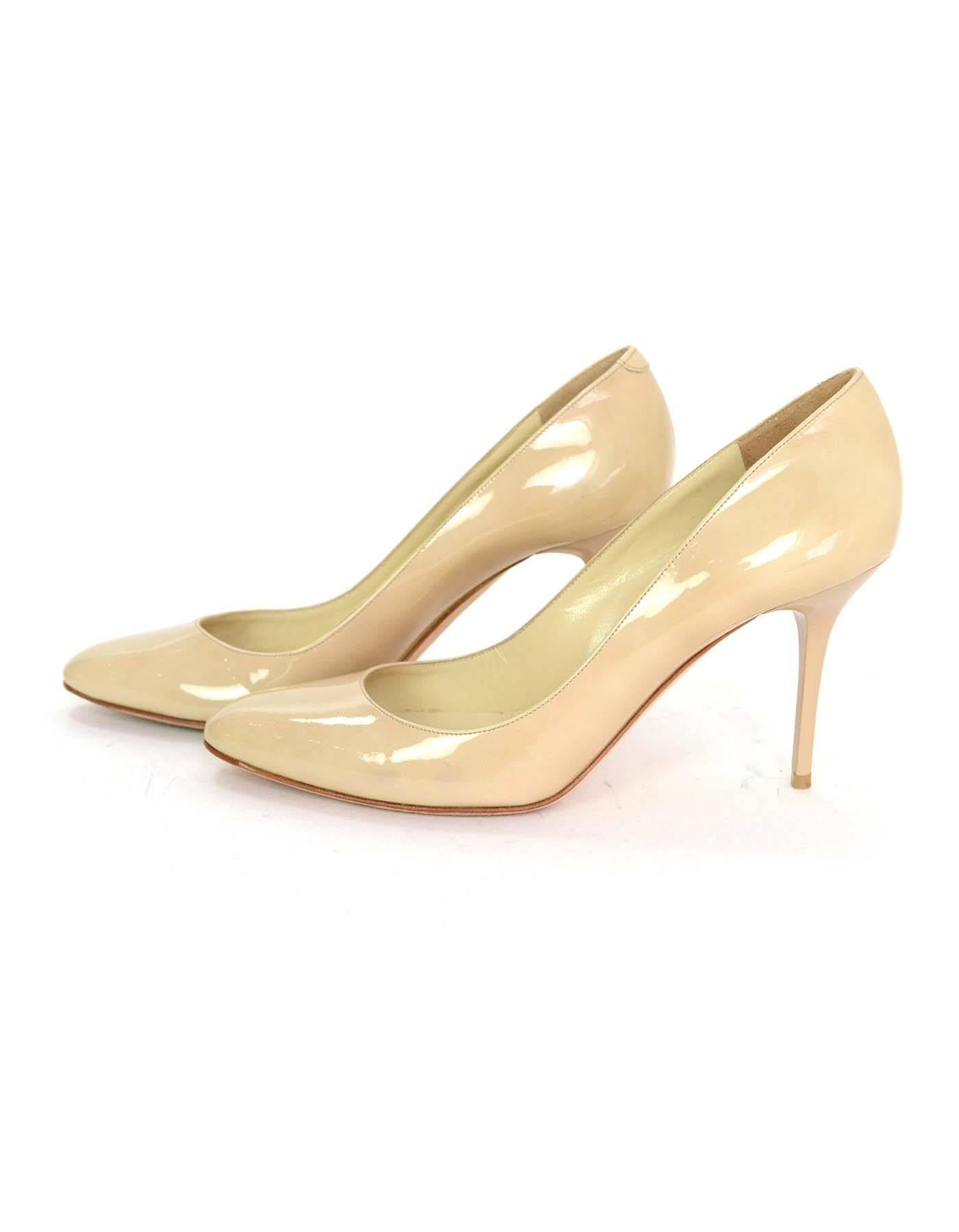 Jimmy Choo Nude Patent Leather Pumps Sz 37.5

Made In: Italy
Color: Nude
Materials: Patent leather
Closure/Opening: Slide on
Sole Stamp: Jimmy Choo London Made in Italy 37.5
Overall Condition: Excellent pre-owned condition with the exception