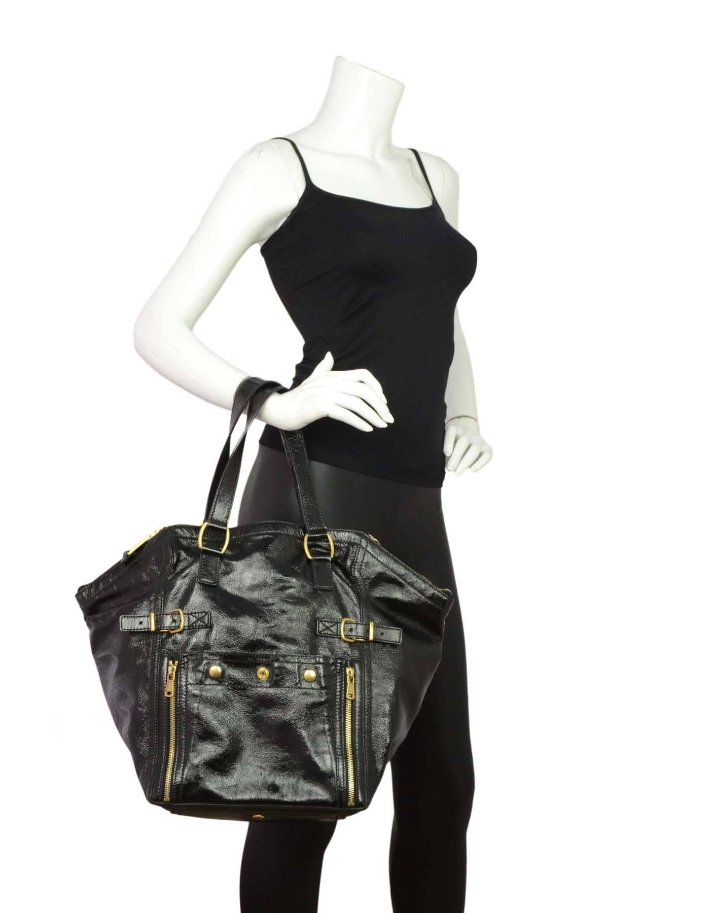 Yves Saint Laurent Black Patent Leather Large Downtown Tote

Made In: Italy
Color: Black
Hardware: Goldtone
Materials: Patent leather and metal
Lining: Black textile
Closure/Opening: Zip closure at sides and open in middle
Exterior Pockets:
