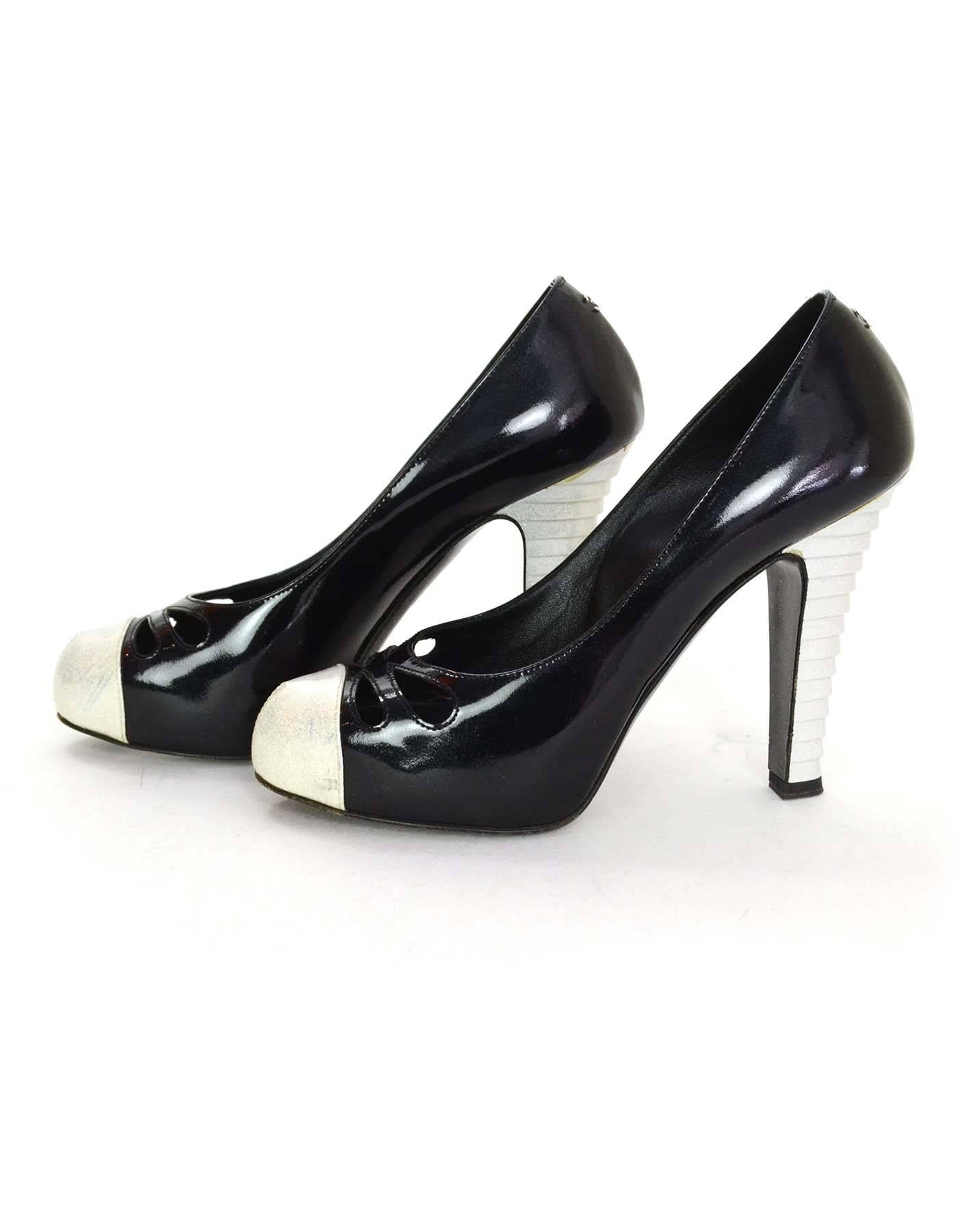 Chanel Black and White Glitter Cap Toe Pumps Sz 38

Features cut-out at toes, embellished heels and hidden platform

Made In: Italy
Color: Black and white
Materials: Patent leather
Closure/Opening: Slide on
Sole Stamp: CC Made in Italy