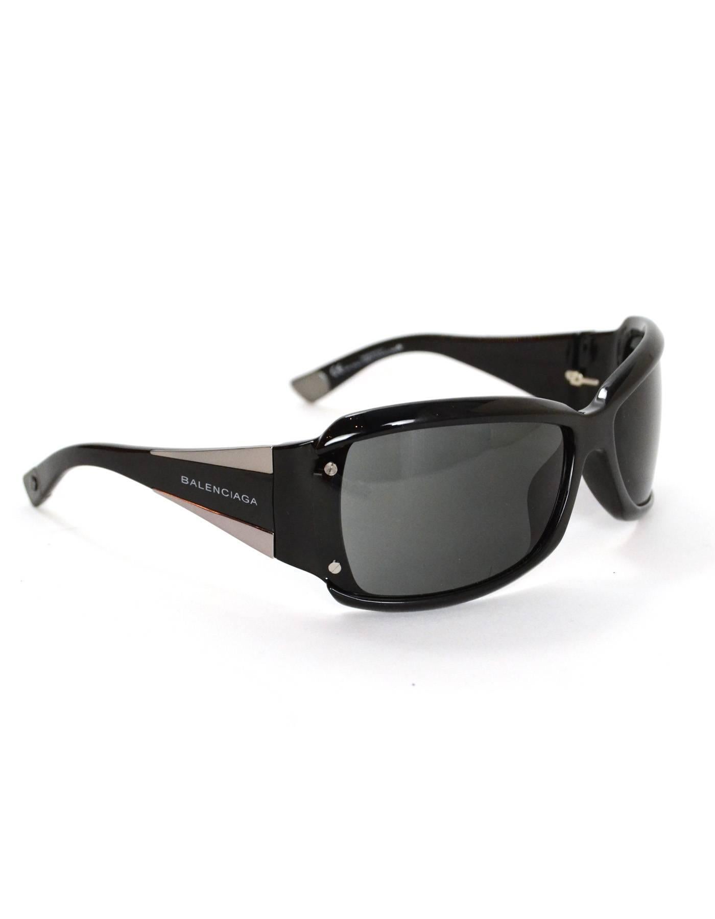 Balenciaga Black and Silvertone Sunglasses

Features logo at arms

Made In: Italy
Color: Black and silvertone
Materials: Resin and metal
Overall Condition: Excellent pre-owned condition with the exception of very light surface