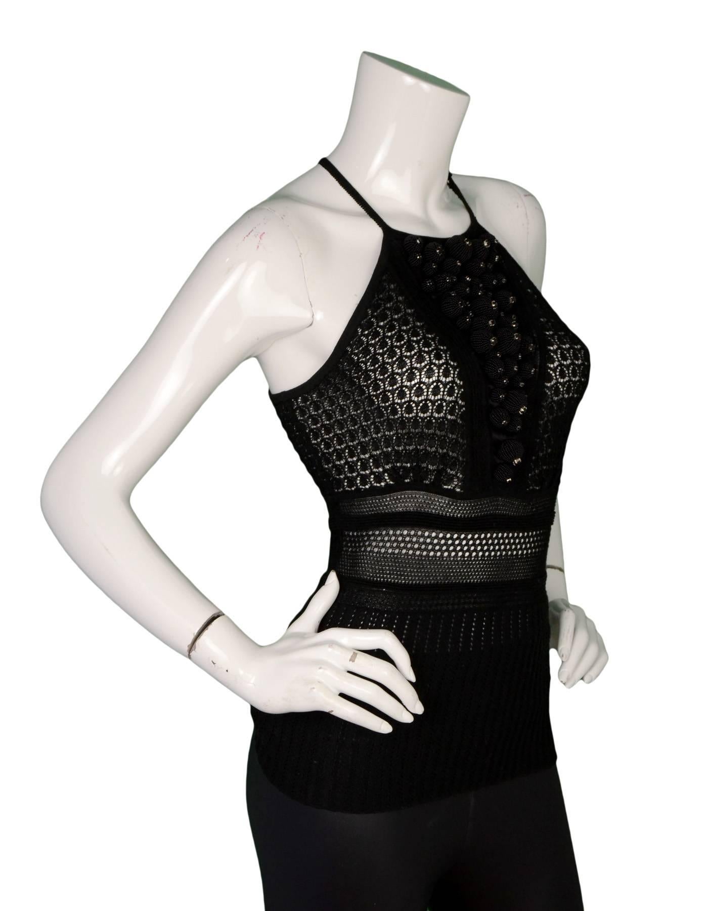 Catherine Malandrino Perforated Top Sz 38

Features cascading beaded ornaments at bust

Made In: Hong Kong
Color: Black
Composition: 82% Cotton, 18% Nylon
Lining: None
Closure/Opening: Pull-over with single button at neckline
Overall