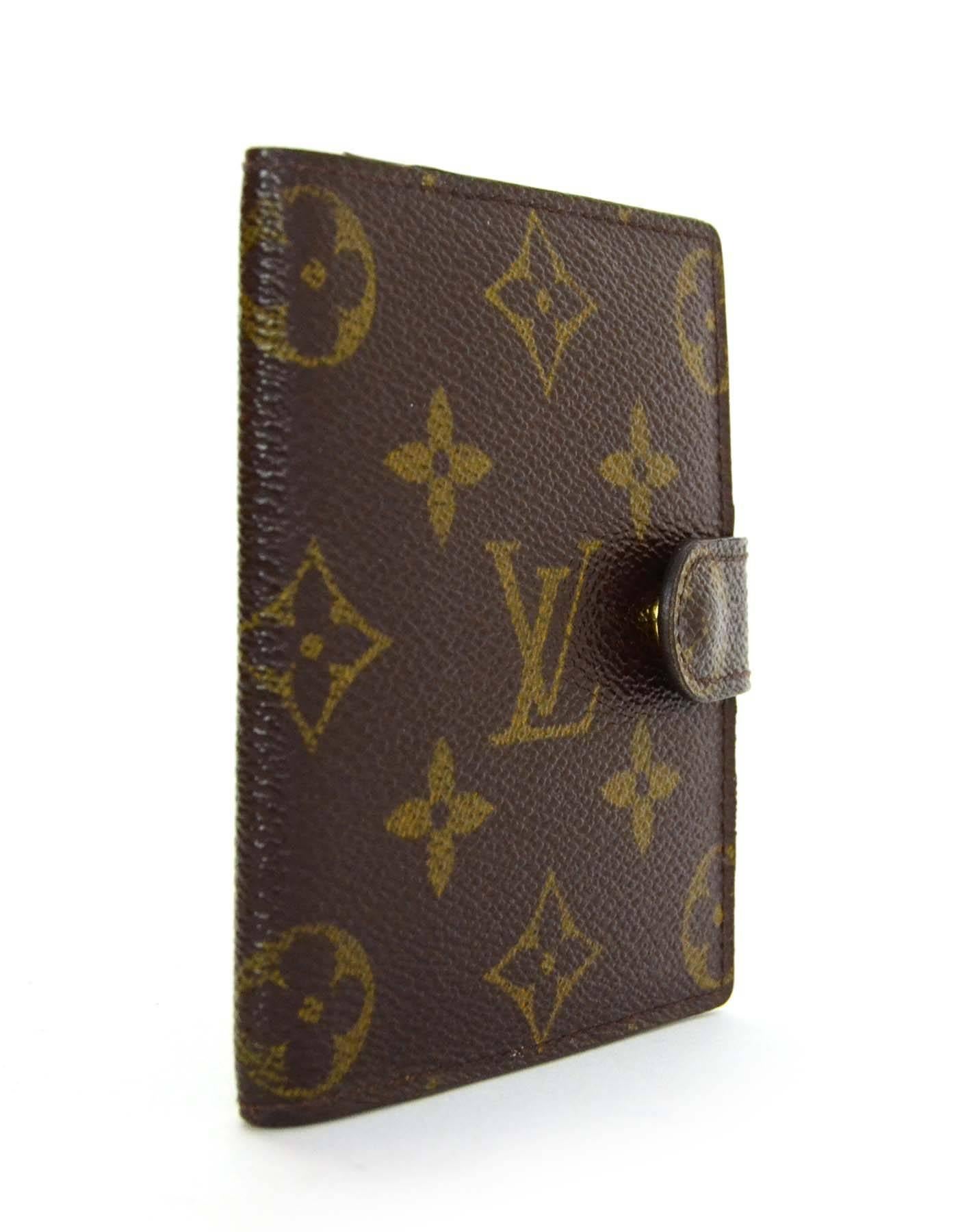 Louis Vuitton Monogram Card Case

Made In: France
Year of Production: 2001
Color: Brown
Materials: Coated canvas
Lining: Brown coated canvas
Hardware: Gold-tone
Closure: Side snap button closure
Serial Number/Date Code: TH1001
Exterior