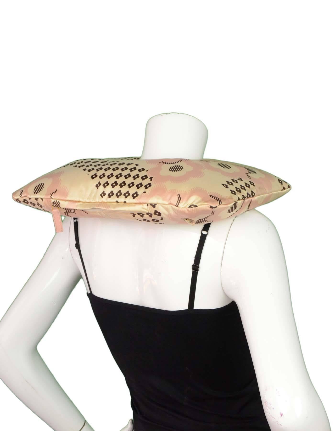 Chanel Pink Silk Travel Neck Pillow

Features CC and floral print throughout 

Color: Pink, nude, brown
Composition: Not listed, believed to be silk blend
Overall Condition: Very good pre-owned condition with the exception of gentle wear