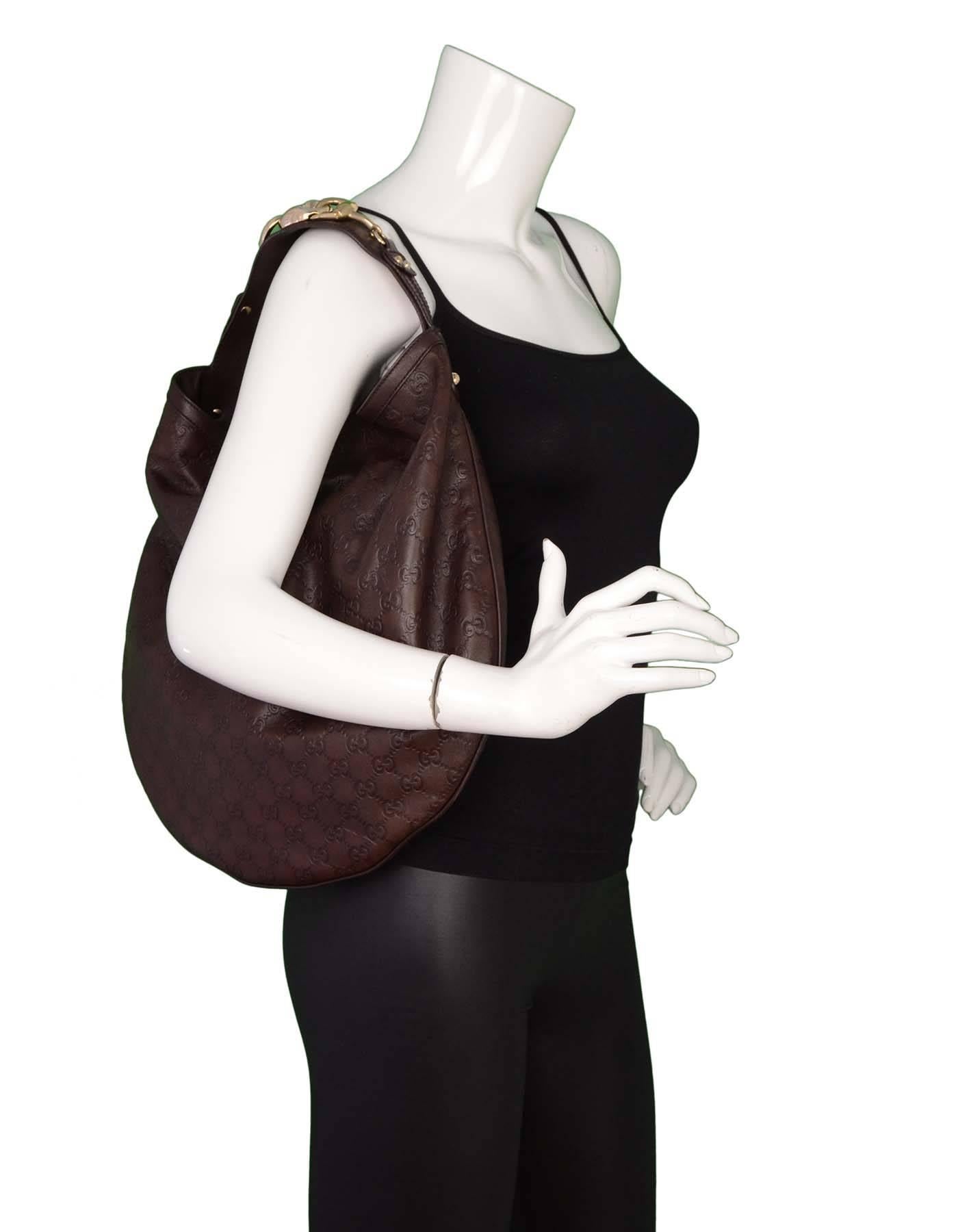 Gucci Brown Embossed Guccissima Leather Hobo

Features monogrammed embossed GG logo throughout and horsbit detail at shoulder strap

Made In: Italy
Color: Brown and gold
Hardware: Goldtone
Materials: Leather and metal
Lining: Ivory, burgundy
