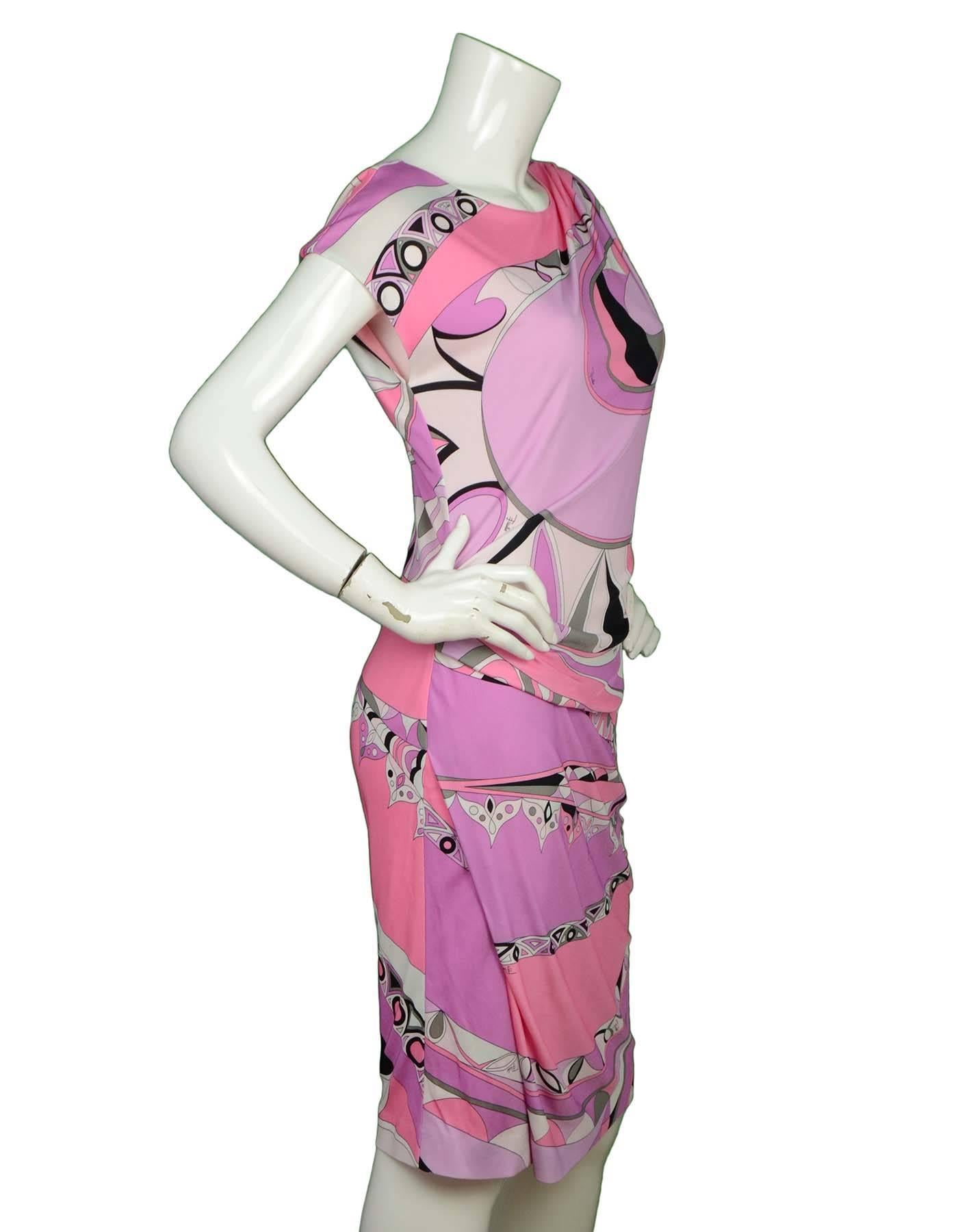 Emilio Pucci Pink and Lavender Dress Sz 10

Features cap sleeves

Made In: Italy
Color: Pink, lavender and black
Composition: 100% Rayon
Lining: Pink under slip
Closure/Opening: Zipper closure at back
Exterior Pockets: None
Interior