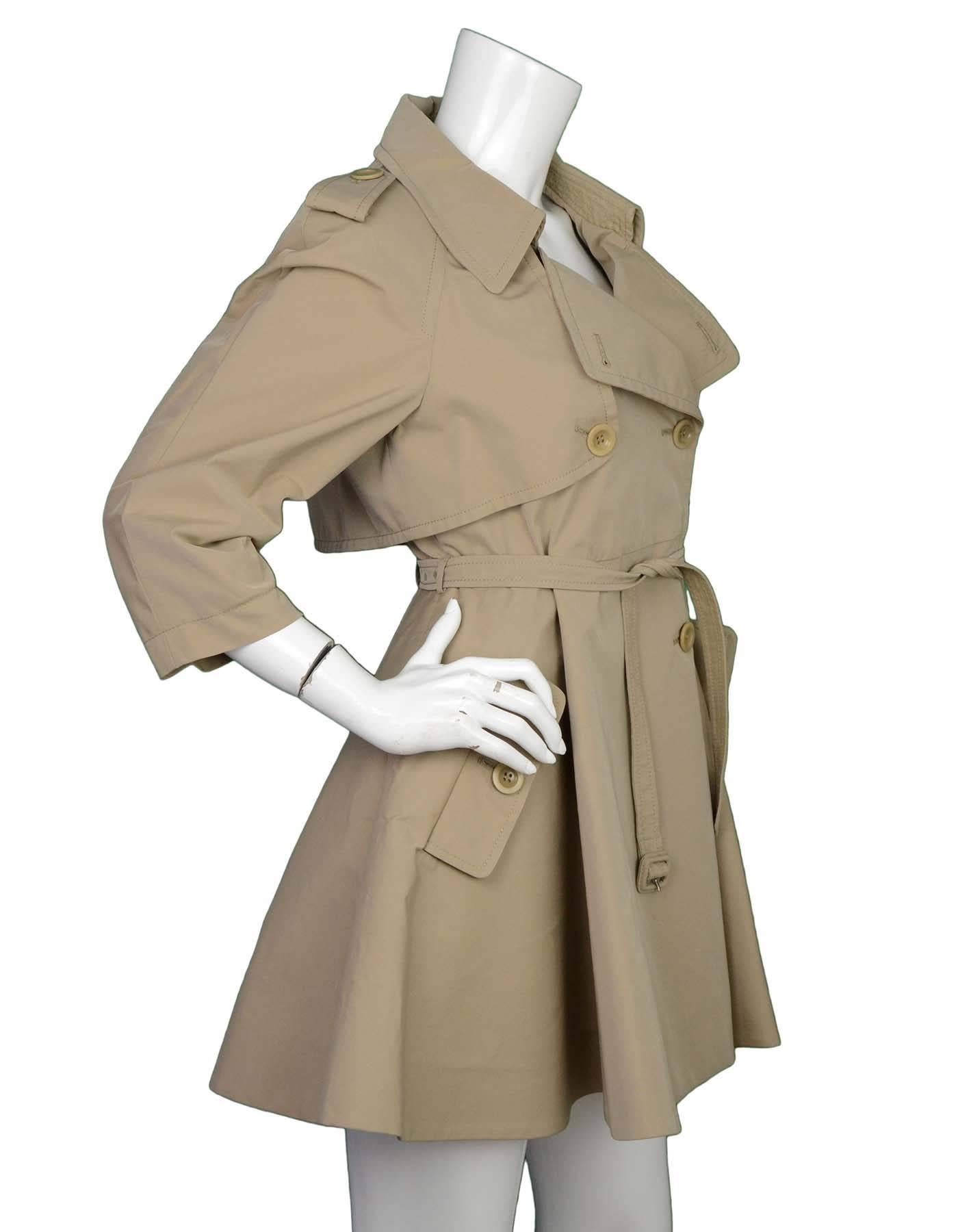 Miu Miu Khaki Flare Trench Coat Sz 40
Features double breasted notch lapels

Made In: Italy
Color: Khaki
Composition: 50% Polyester 50% Cotton
Lining: Cream liner
Closure/Opening: Double breasted button front closure and belt at