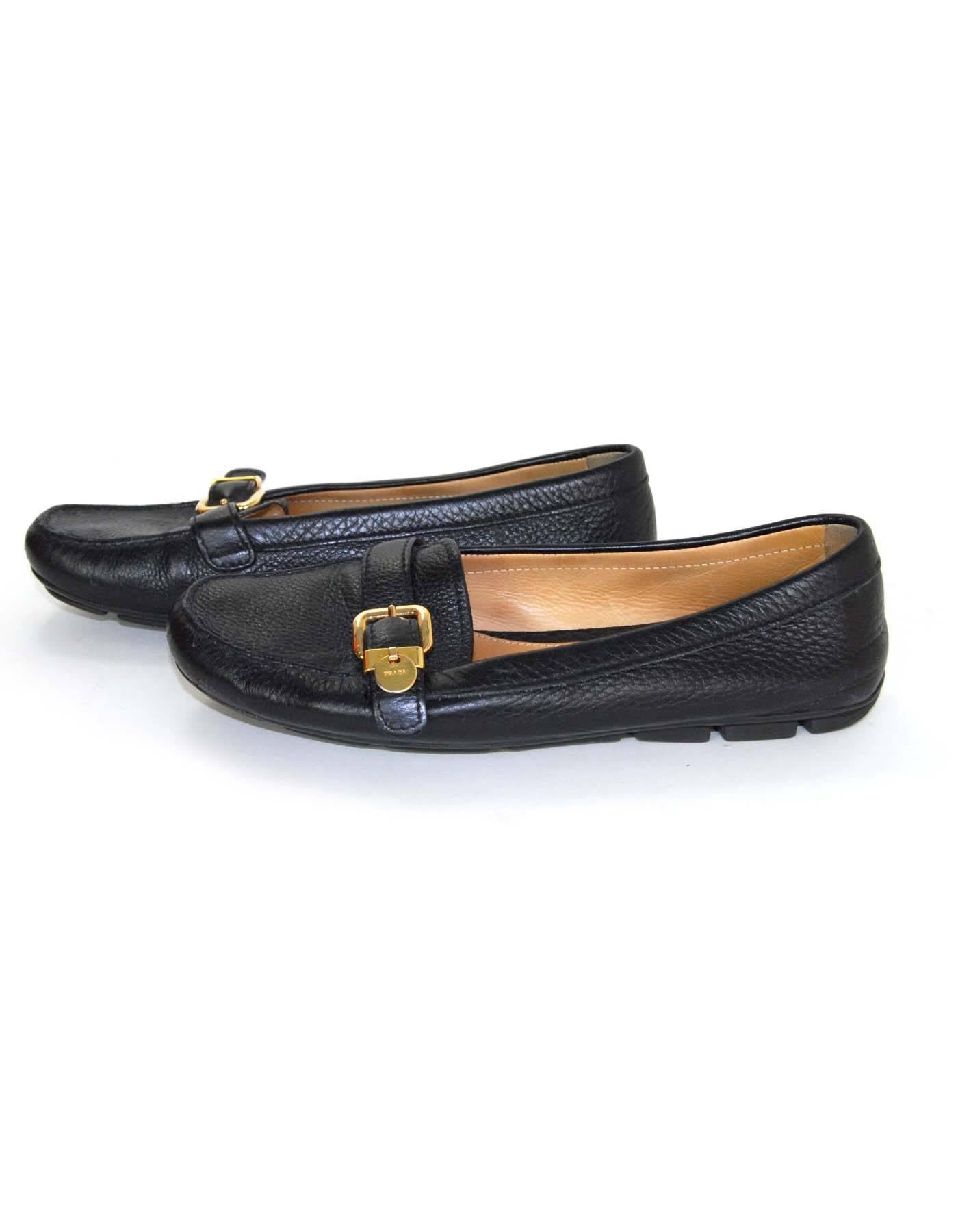 Prada Black Leather Driving Loafers Sz 40.5

Features goldtone buckle

Color: Black
Materials: Leather
Closure/Opening: Slide on
Sole Stamp: Prada
Overall Condition: Very good pre-owned condition with the exception of some wear to in soles
