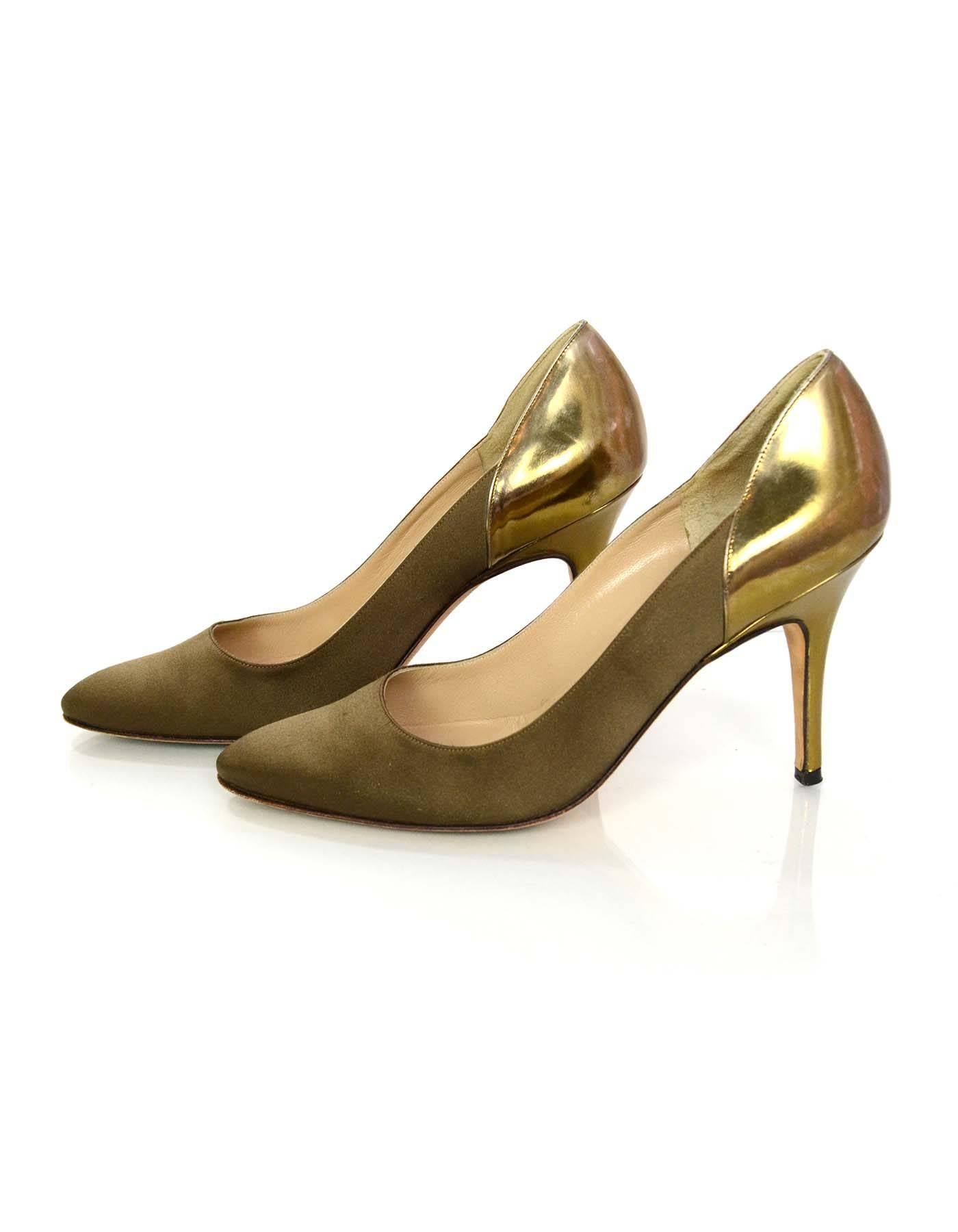 Manolo Blahnik Bronze Satin Pumps Sz 38

Features patent heels

Color: Bronze
Materials: Satin and leather
Closure/Opening: Slide on
Sole Stamp: Manolo Blahnik 38
Overall Condition: Excellent pre-owned condition with the exception of light