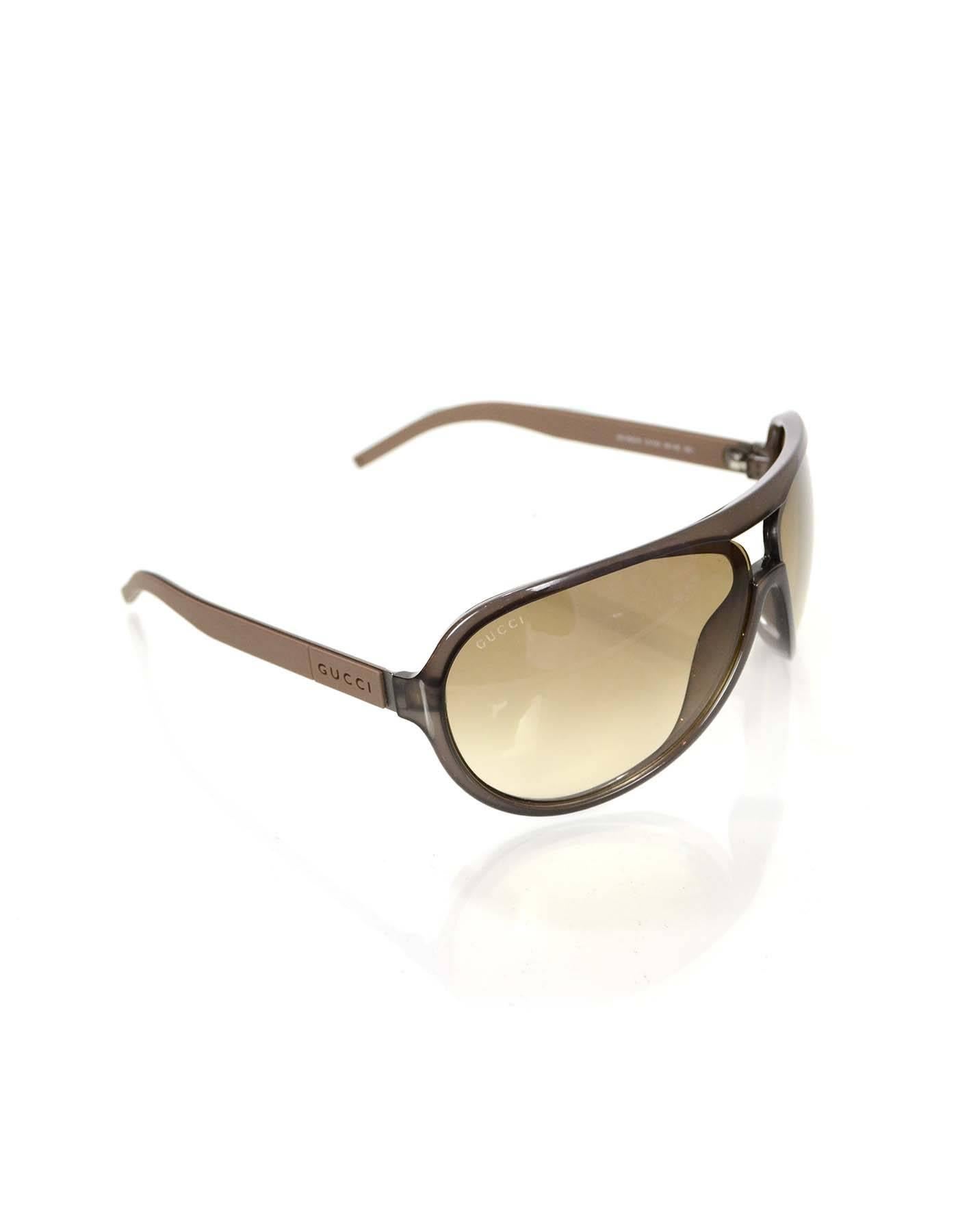 Gucci Brown Aviator Sunglasses

Made In: Italy
Color: Brown
Materials: Resin, metal
Overall Condition: Excellent pre-owned condition with the exception of very light surface marks
Includes: Gucci case
Measurements:
Length Across: