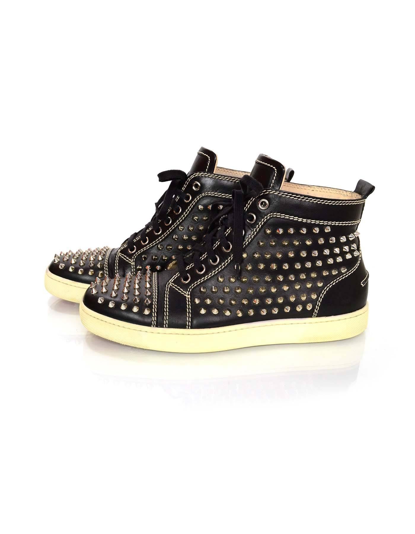 Christian Louboutin Leather Louis Spike Sneakers Sz 41

Features silvertone studding throughout

Color: Black, silvertone
Materials: Leather, rubber, metal
Closure/Opening: Lace tie closure
Retail Price: $1,295 + tax
Sole Stamp: Christian