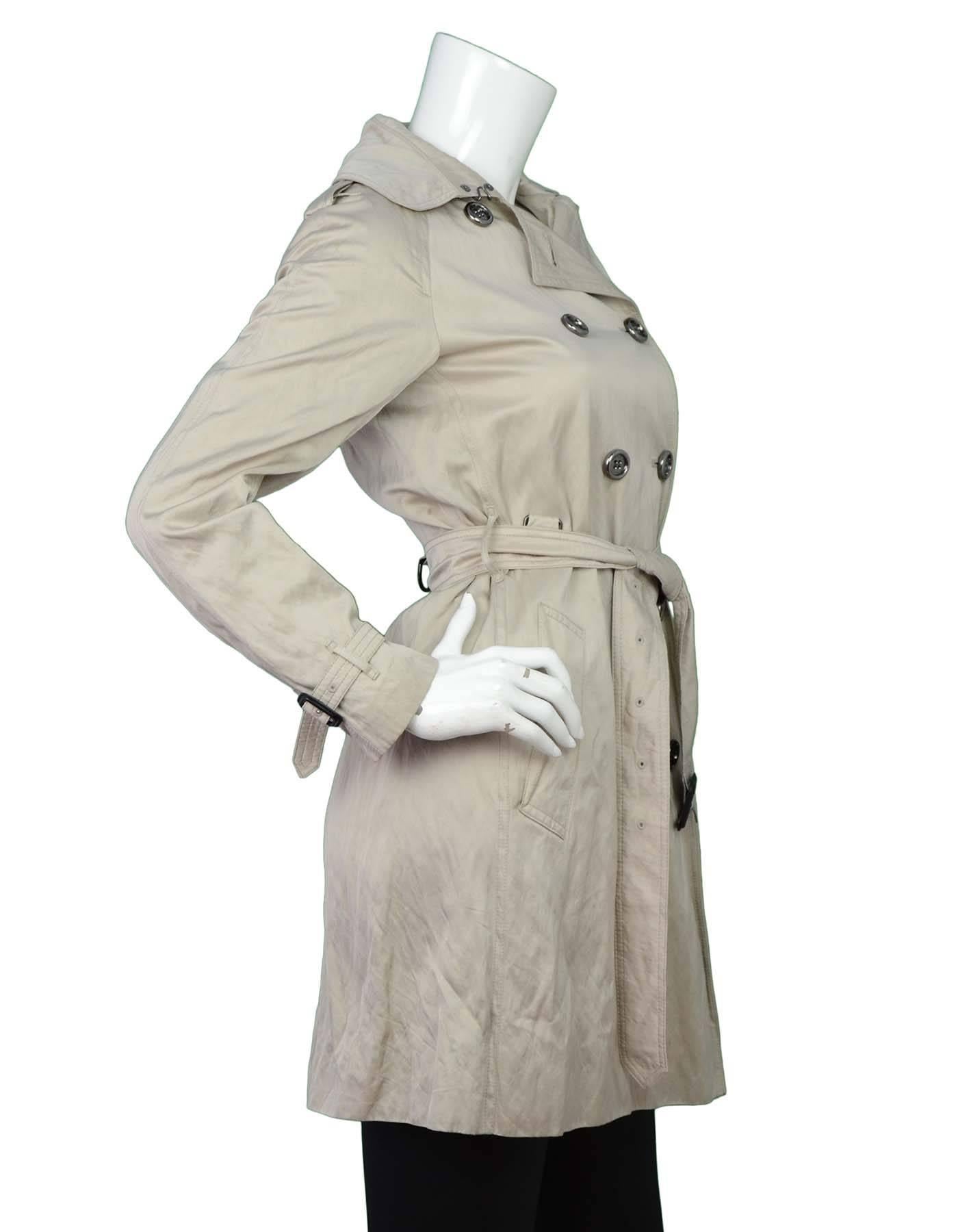 Burberry Khaki Trench Coat Sz 4
Features double-breast buttons and belt at waist

Made In: Bosnia
Color: Iridescent khaki
Composition: 51% viscose, 43% cotton, 6% metallic fibers
Lining: Grey nova check
Closure/Opening: Double breasted button