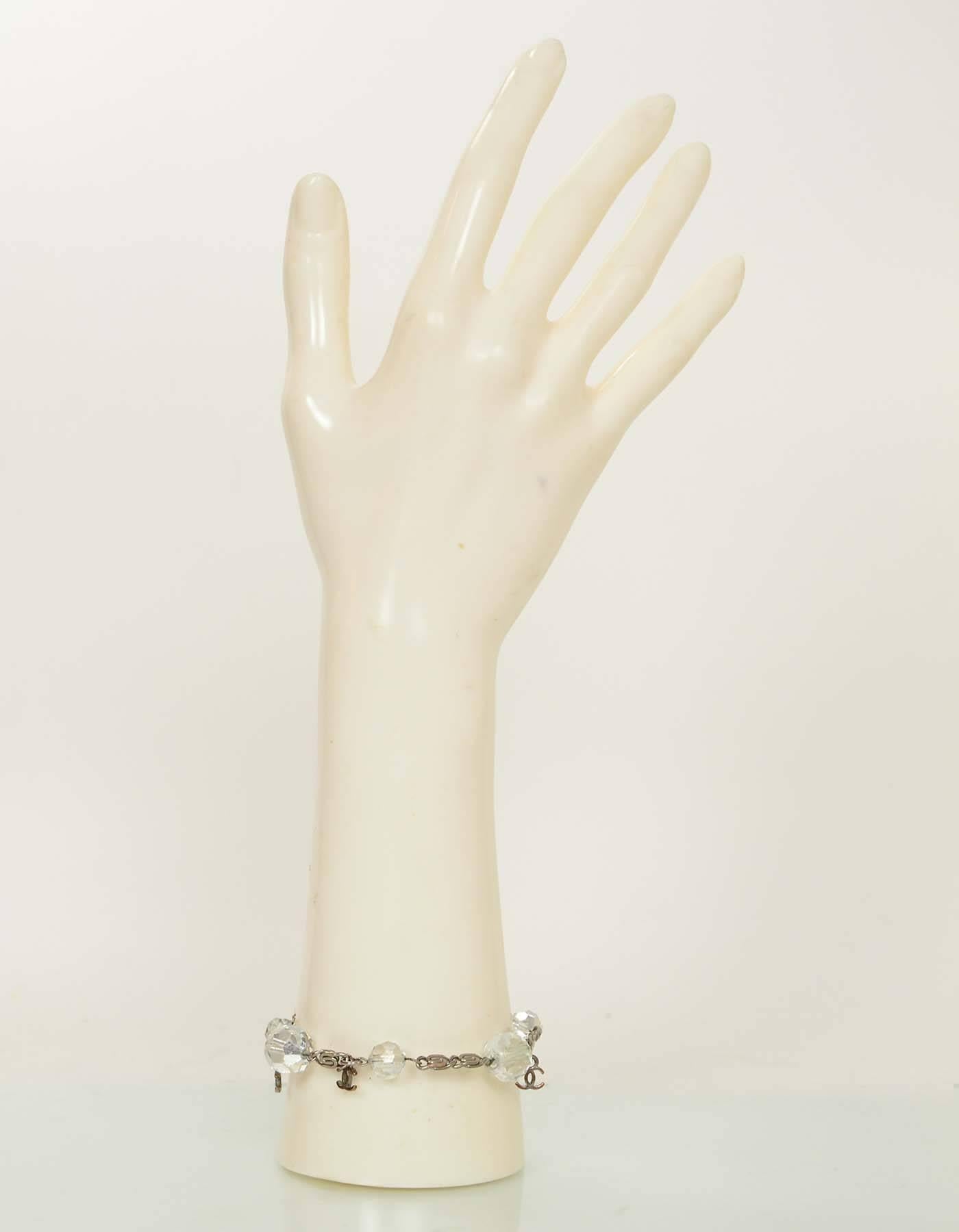 Chanel Clear Bead CC Bracelet

Made In: France
Production Year: 2000 Cruise
Stamp: Chanel 00 CC C made in france
Color: Clear, silver
Materials: Metal, resin
Closure: Lobster claw closure
Overall Condition: Very good pre-owned condition with