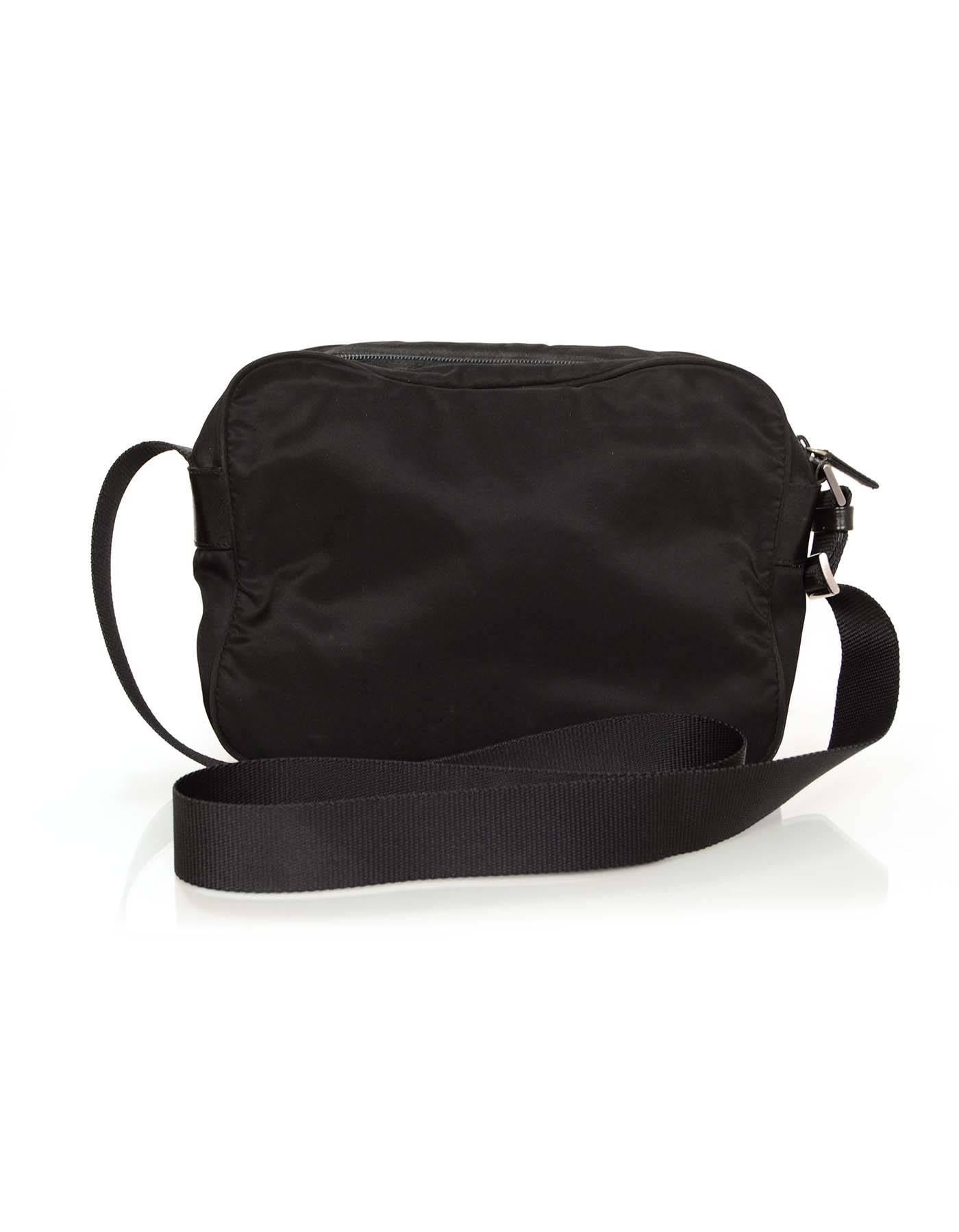 100% Authentic Prada Black Nylon Zip Around Messenger Bag features front zip pocket for easy access to important items in your bag. Crossbody strap can be adjusted to be worn as a shoulder bag.

Made in: Italy
Color: Black
Hardware: