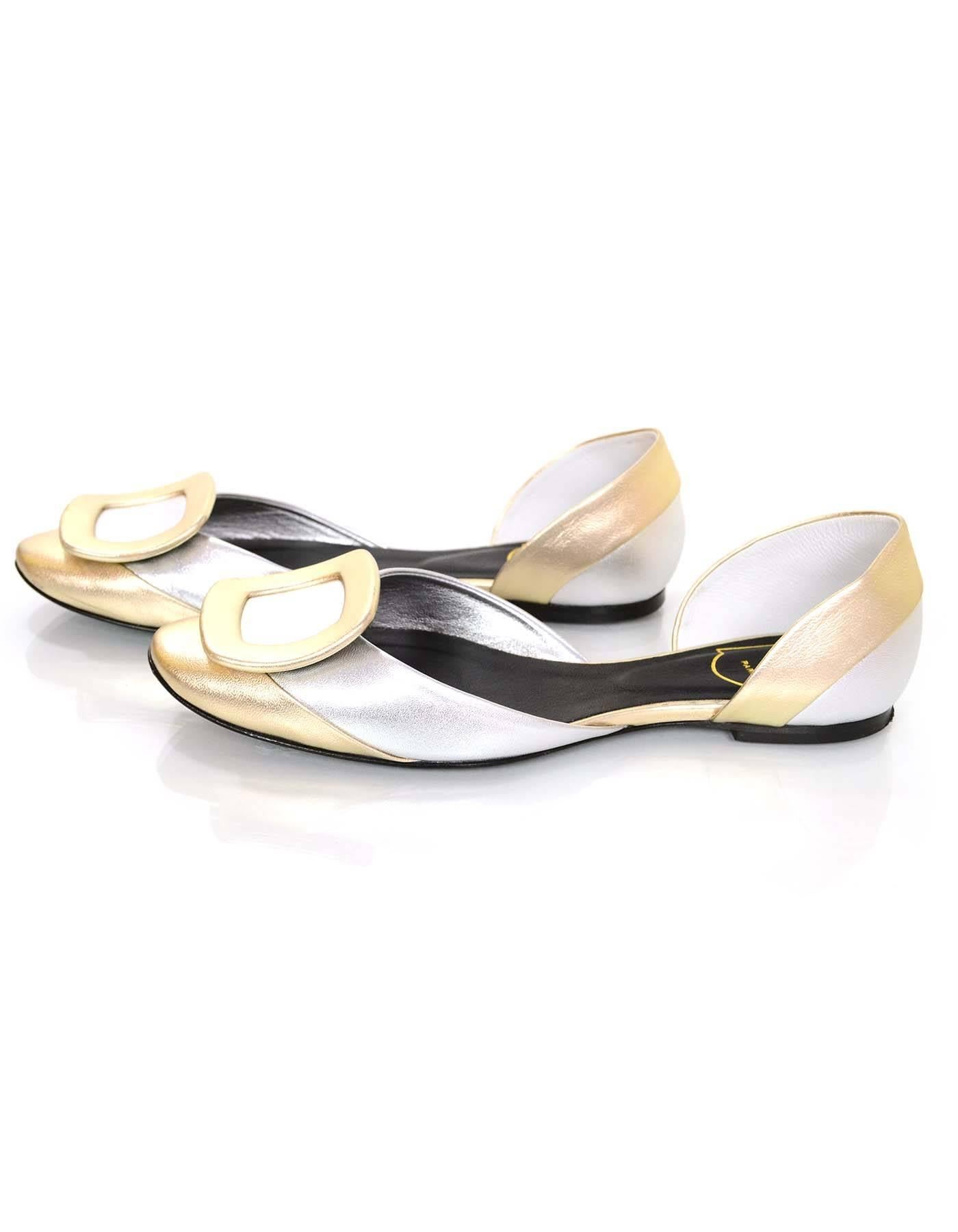 Roger Vivier Chips Pilgram Leather d'Orsay Flats Sz 37

Made In: Italy
Color: Gold and silver
Materials: Leather
Closure/Opening: Slide on
Sole Stamp: RV Made in Italy Women's size 37
Overall Condition: Excellent pre-owned condition with the