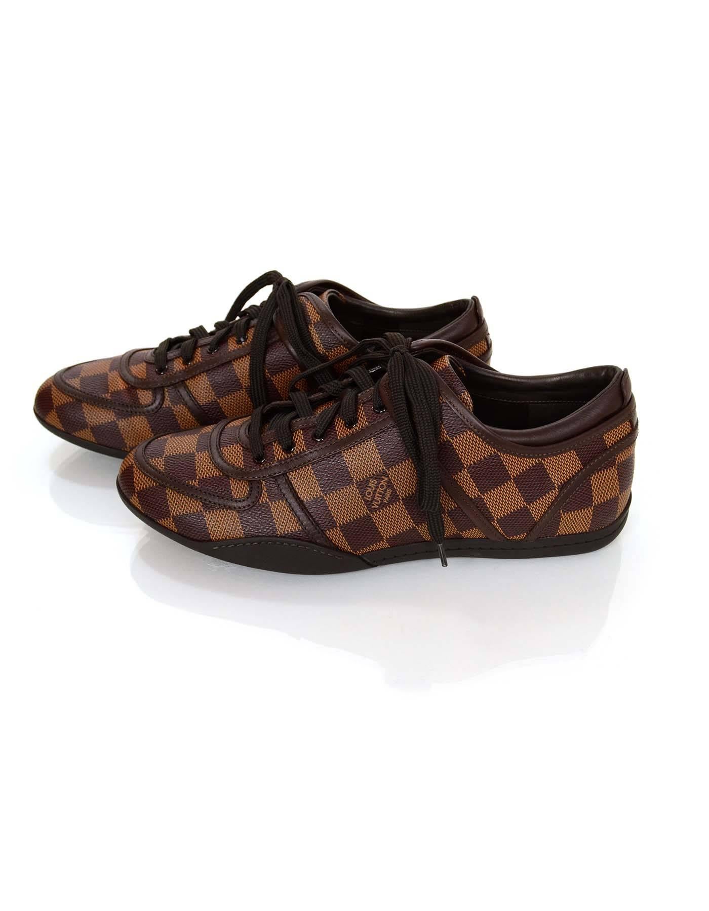 Louis Vuitton Damier Boogie Sneakers Sz 38

Color: Brown
Materials: Coated canvas, leather, rubber
Closure/Opening: Lace tie closure
Sole Stamp: LV
Overall Condition: Excellent pre-owned condition with the exception of very light crease marks