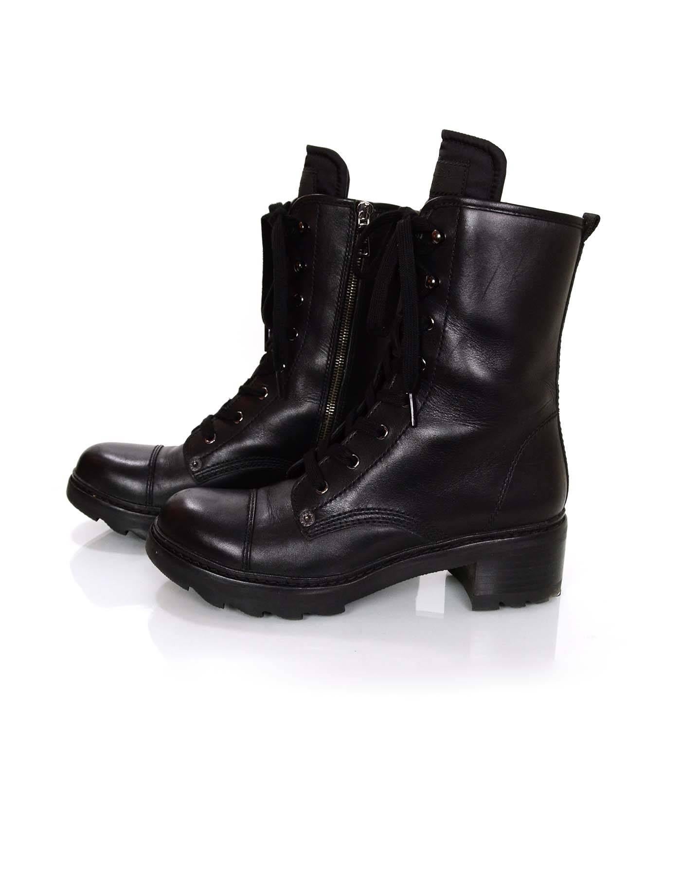 Prada Sport Black Leather Combat Boots Sz 38.5

Made In: Italy
Color: Black
Materials: Leather and rubber
Closure/Opening: Lace tie closure at front and zip closure at side
Sole Stamp: Prada 
Overall Condition: Excellent pre-owned condition